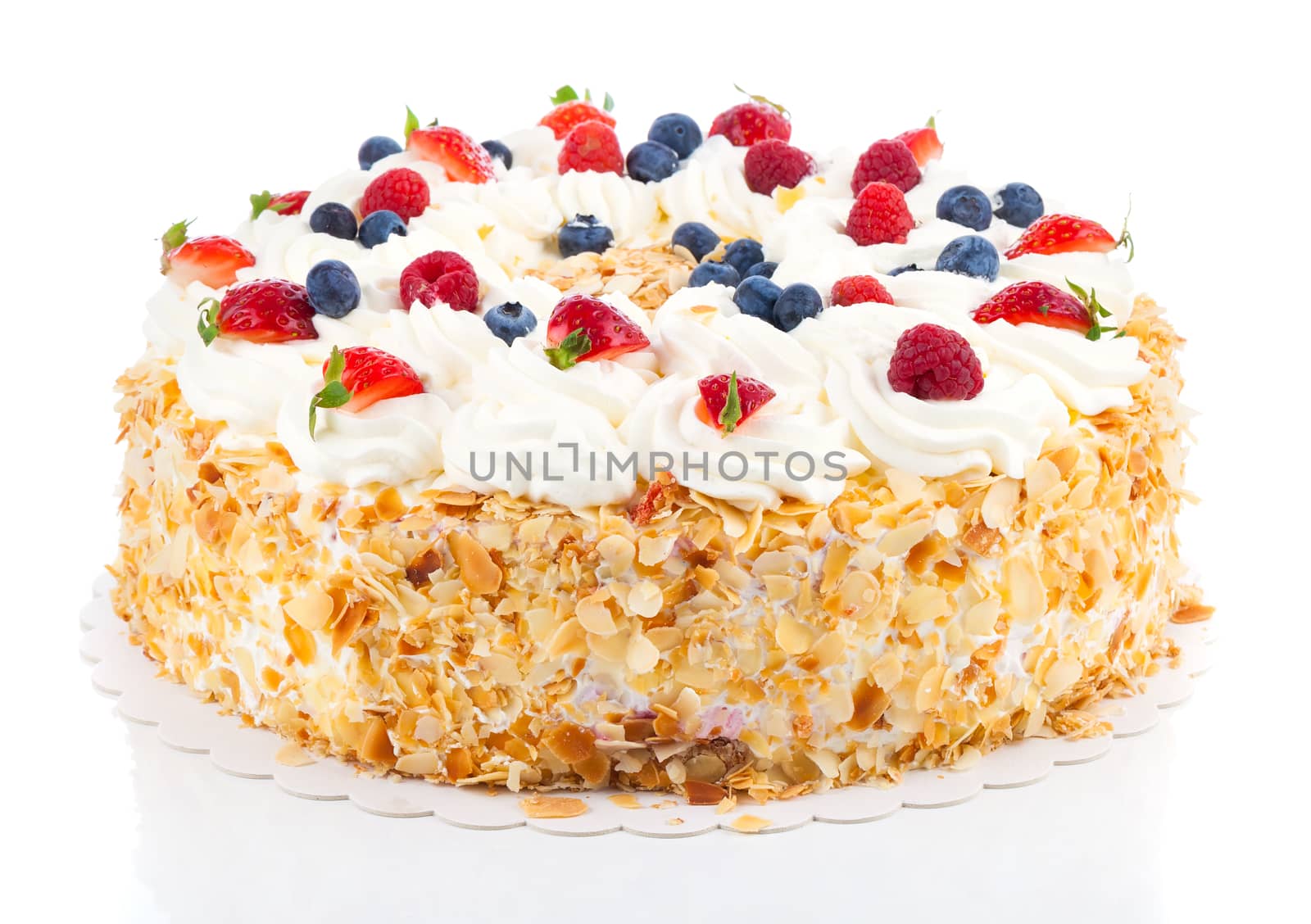 White Cream Icing Cake with Fruits, on a white background