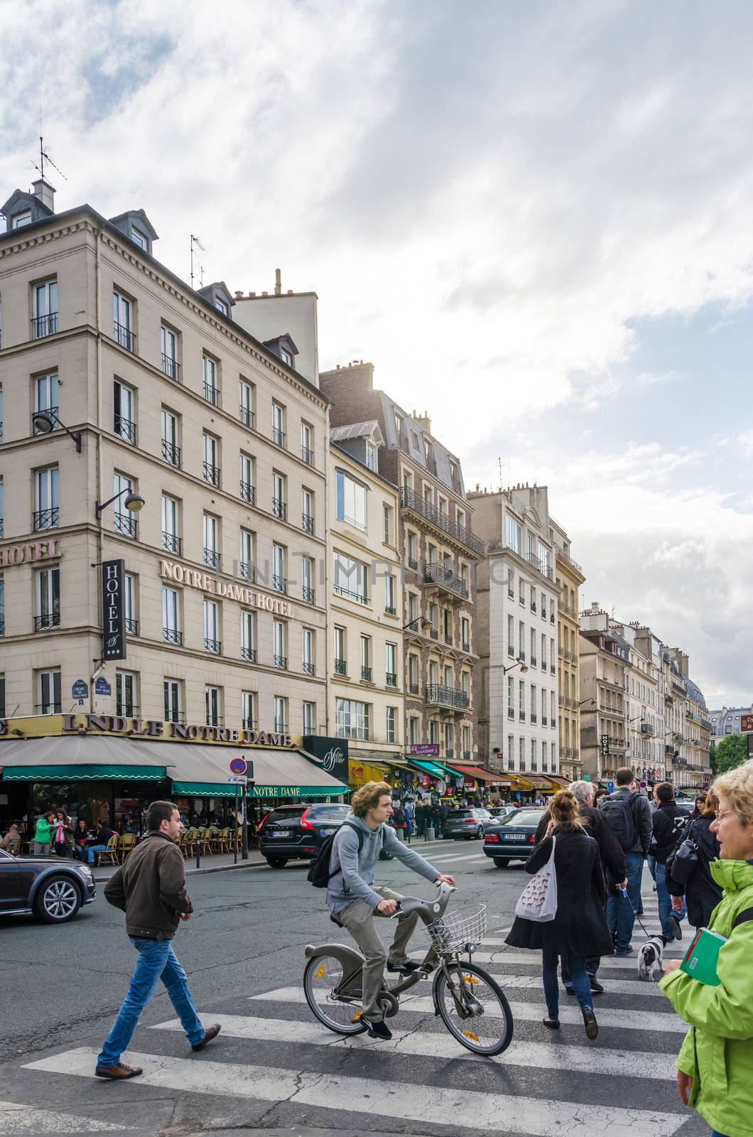 Paris, France - May 14, 2015: French People in Cite Island, Paris, France. on May 14, 2015. It is the centre of Paris and the location where the medieval city was refounded.