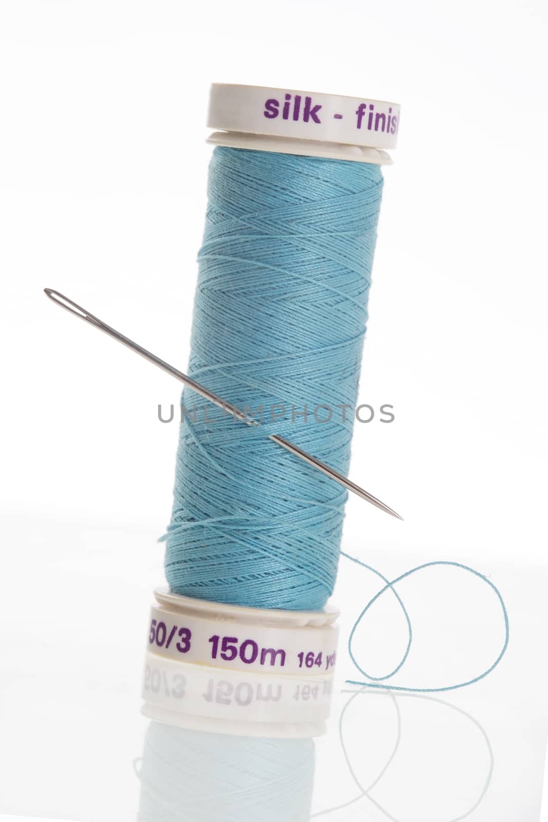 Blue thread with needle