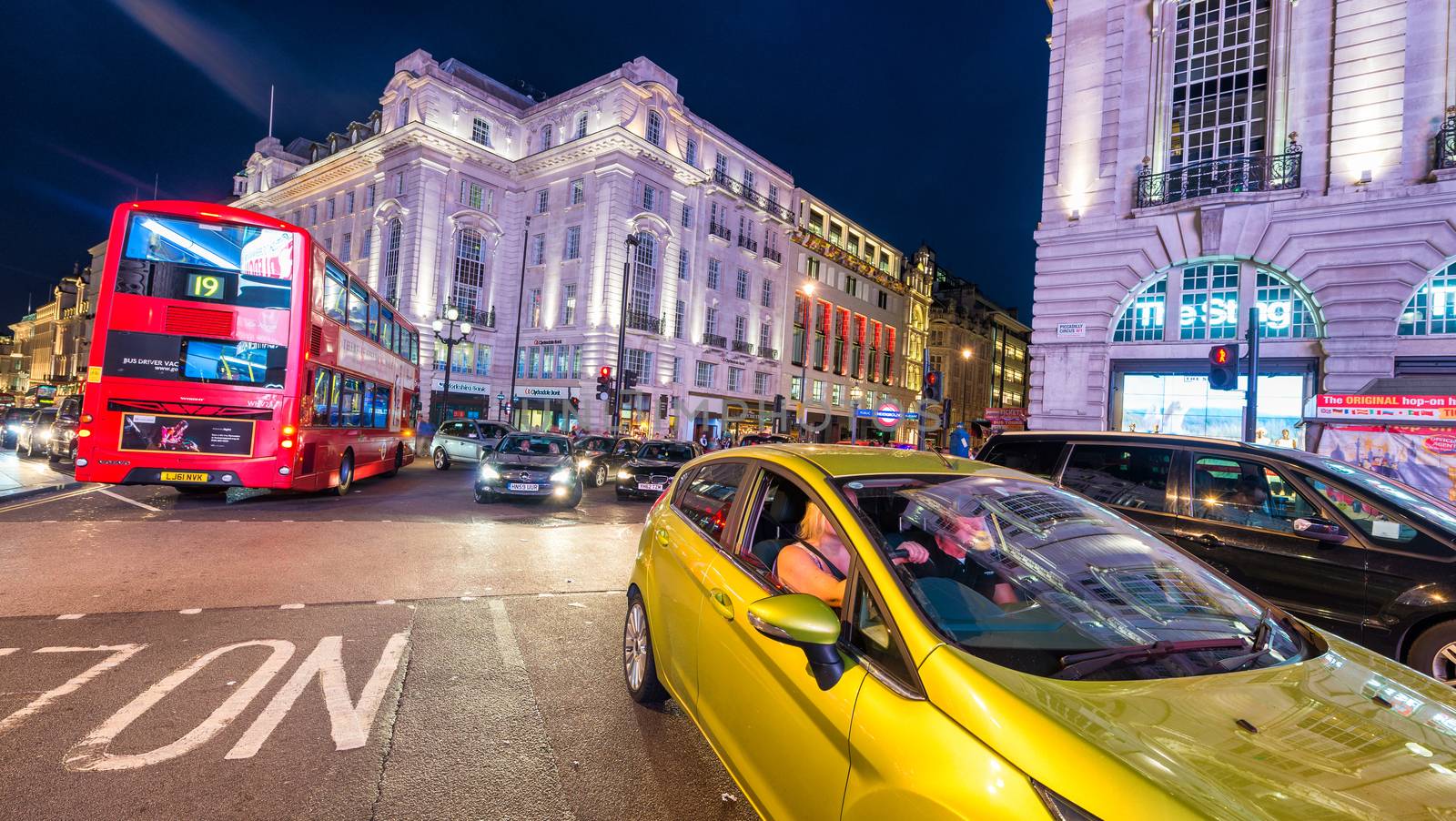 LONDON - JUNE 16, 2015: Traffic in Piccadilly Circus area. Piccadilly signs have become a major attraction of London.