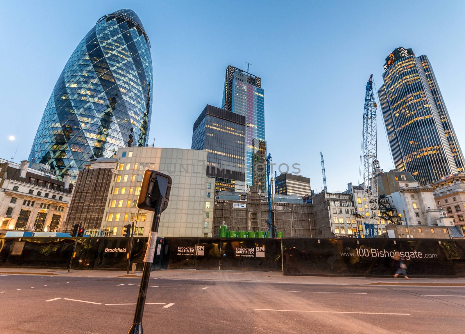 LONDON - JUNE 13, 2015: The Gherkin at sunset. The building is a commercial skyscraper in London's primary financial district, the City of London.