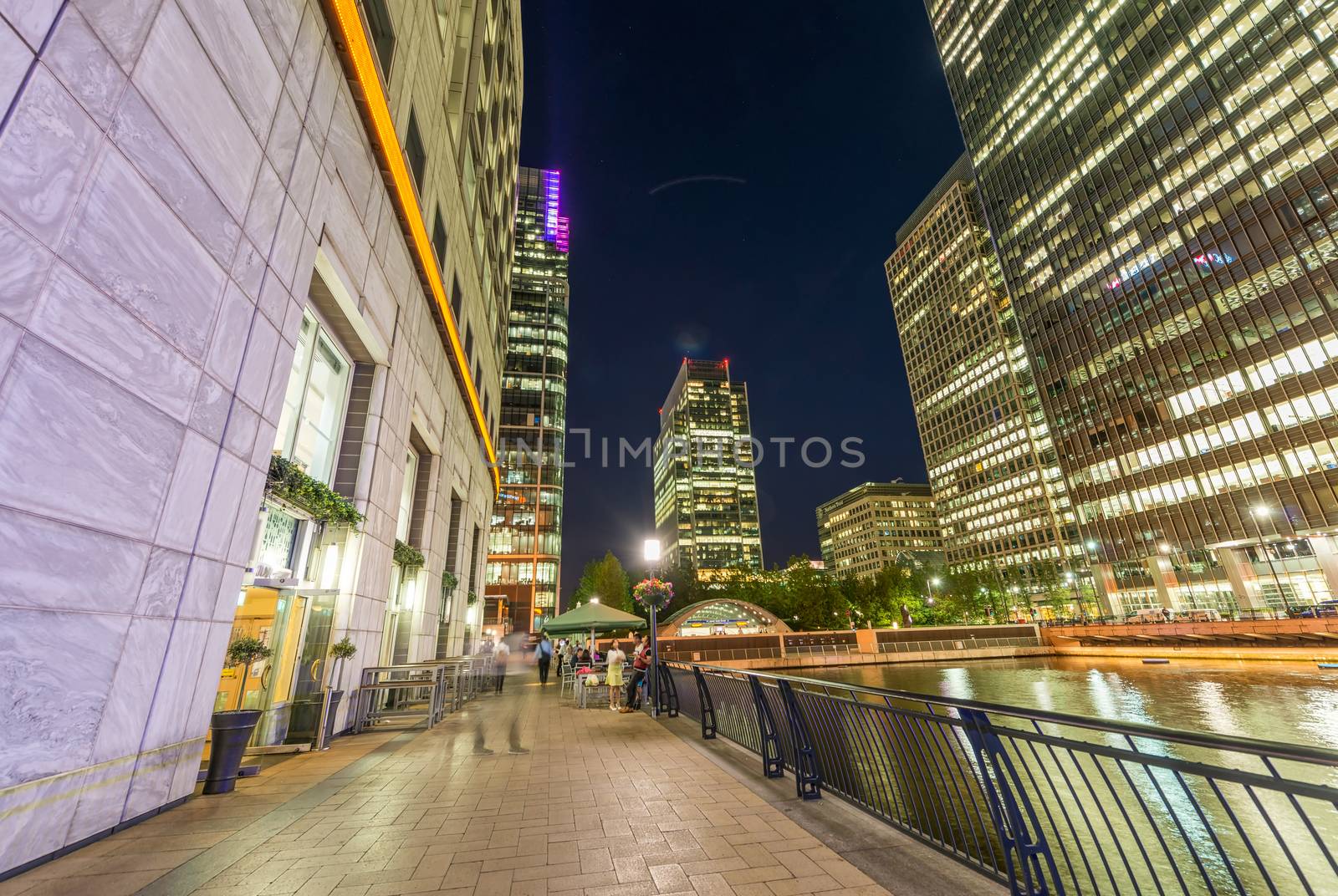 Beautiful Canary Wharf skyline at night, London from street level.