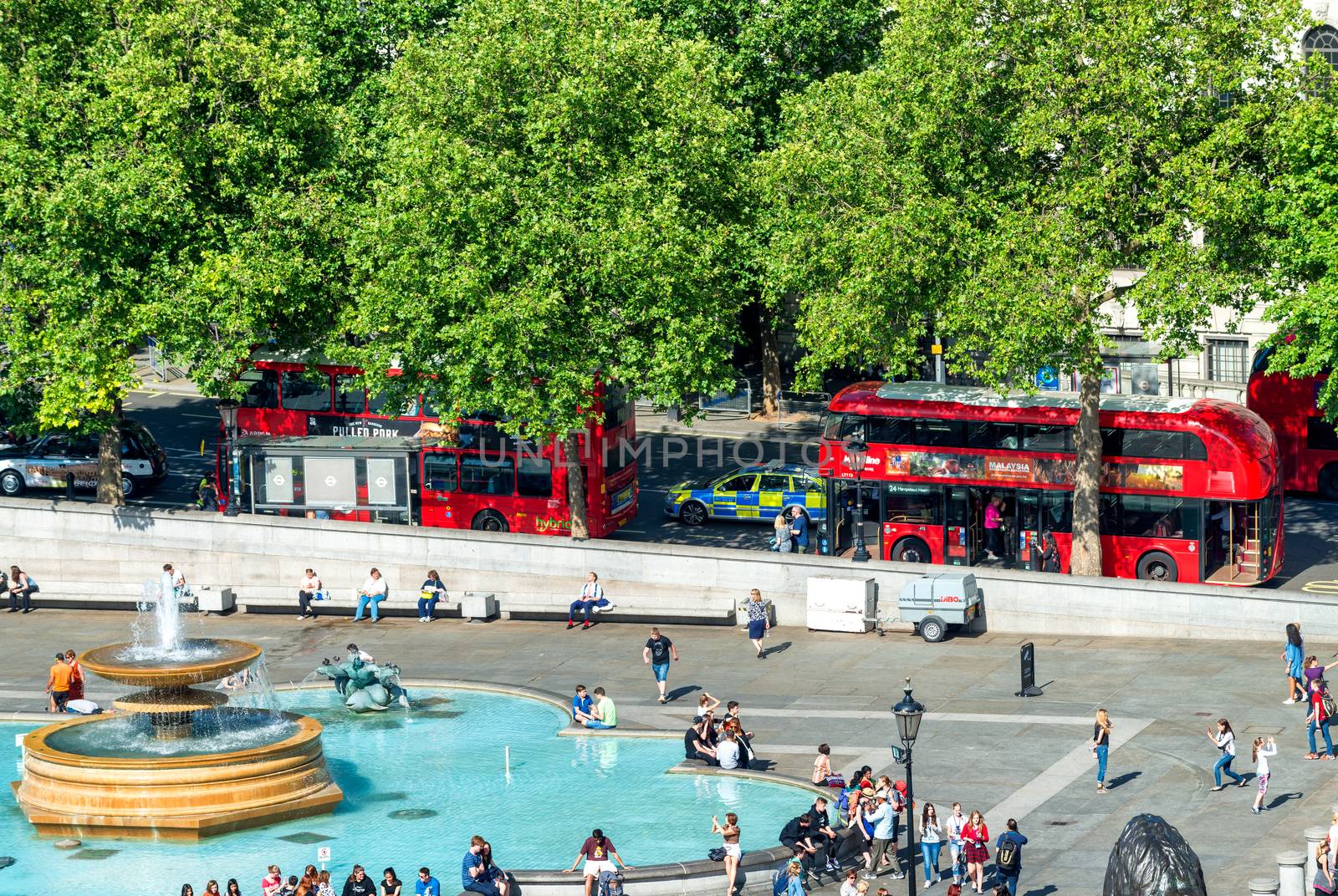 LONDON - JUNE 12, 2015: Tourists in Trafalgar Square. London att by jovannig