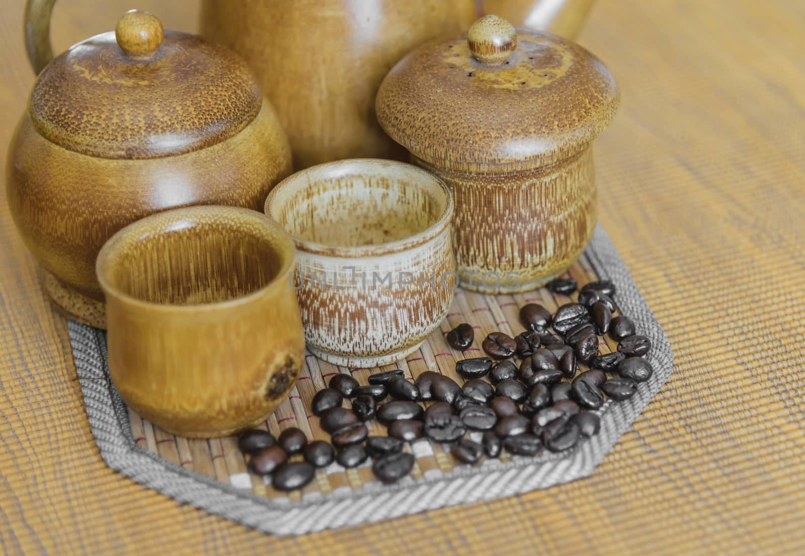 Soft focus image of coffee beans and coffee cups set on wooden background.Vintage style.(soft focus)