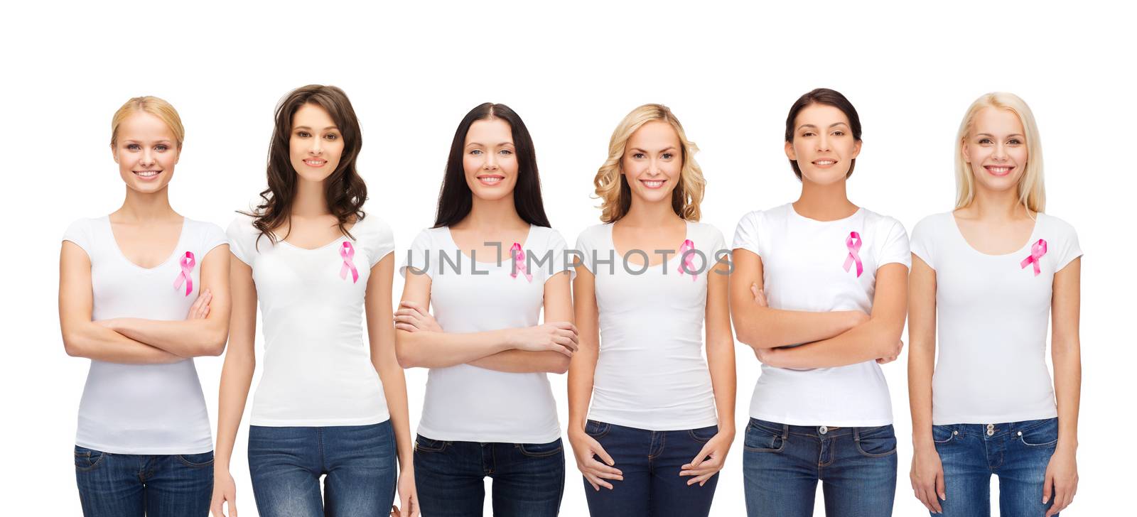 smiling women with pink cancer awareness ribbons by dolgachov
