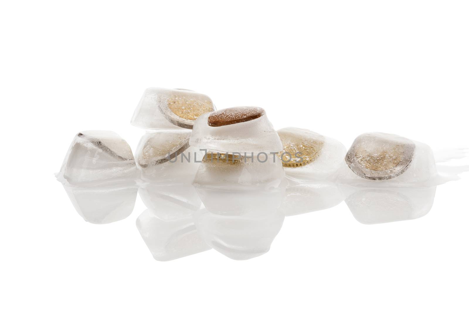 Euro money frozen in ice cubes isolated on white background. Frozen account, melting economy and transparent money flow. 