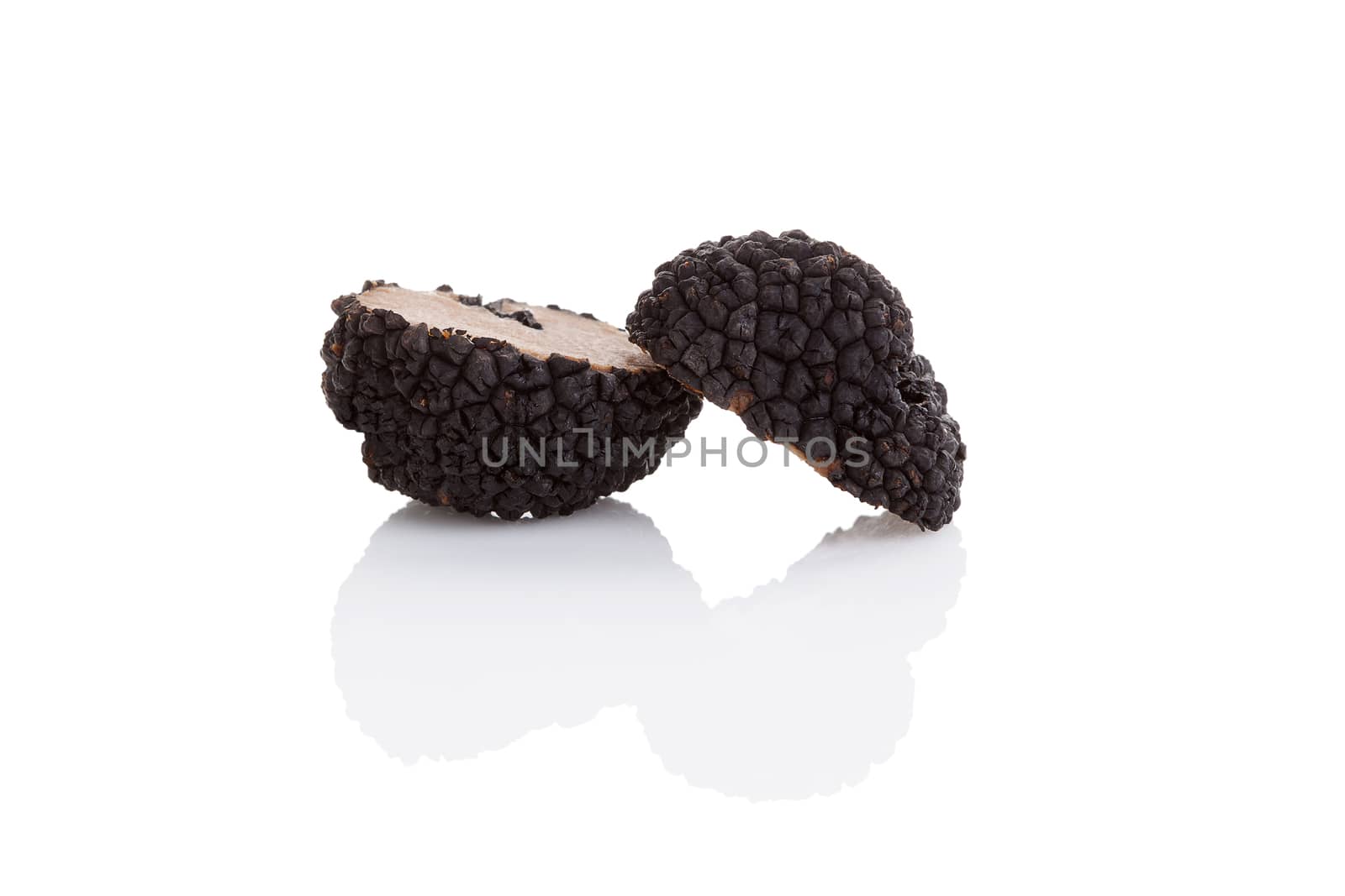 Cut truffles isolated on white background. Luxurious culinary cooking ingredienets. 