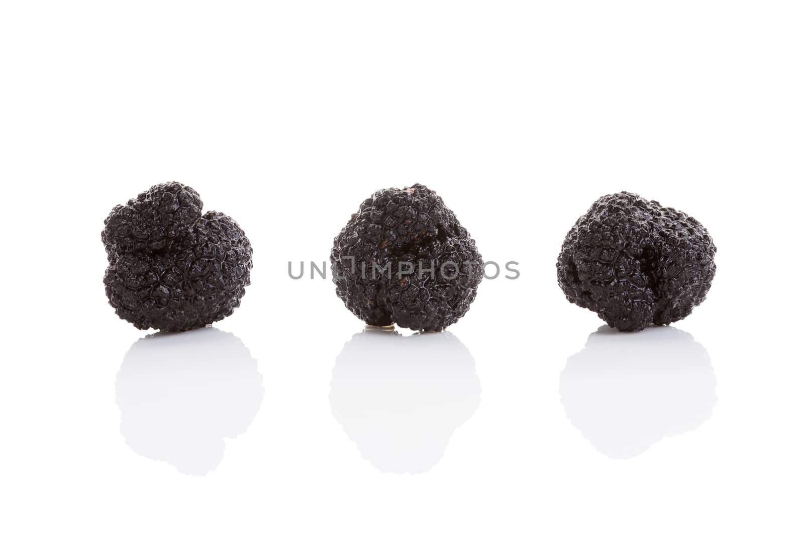 Three truffle isolated on white. Luxurious culinary cooking ingredienets. 