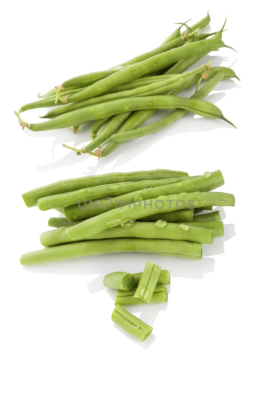 Fresh green beans with water drops isolated on white background. Healthy eating. 