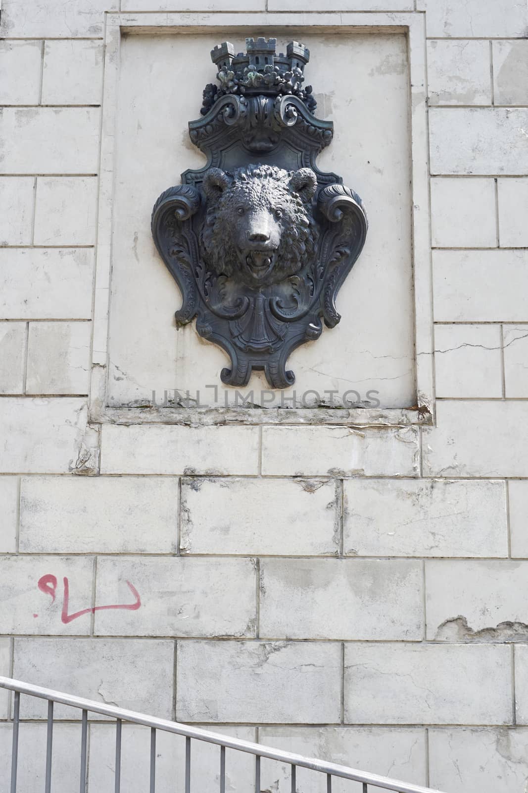 BERLIN, GERMANY - JULY 08: Berlin crest on wall showing the symbol of the city, a brown bear head. July 08, 2015 in Berlin.