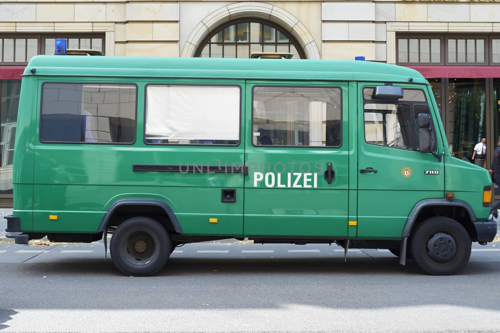 BERLIN, GERMANY - JULY 08: Empty green police van parked in the street. July 08, 2015 in Berlin.