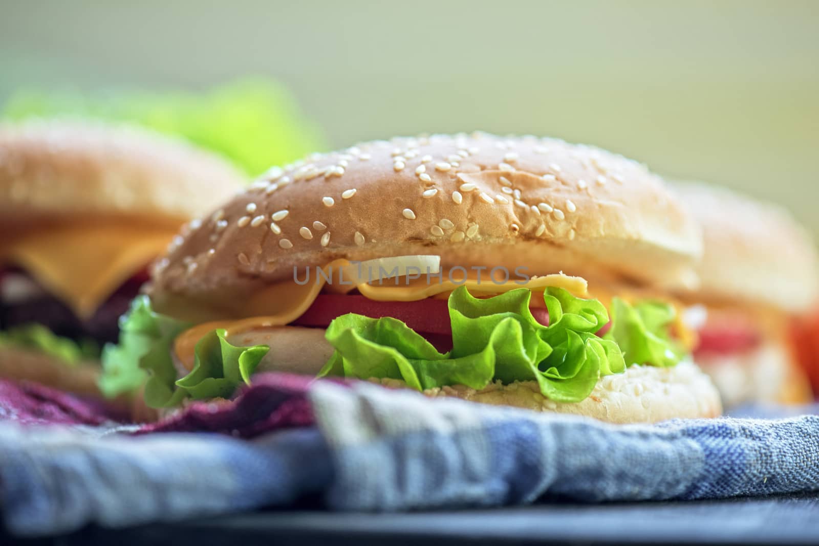 Closeup of home made burgers on wooden table