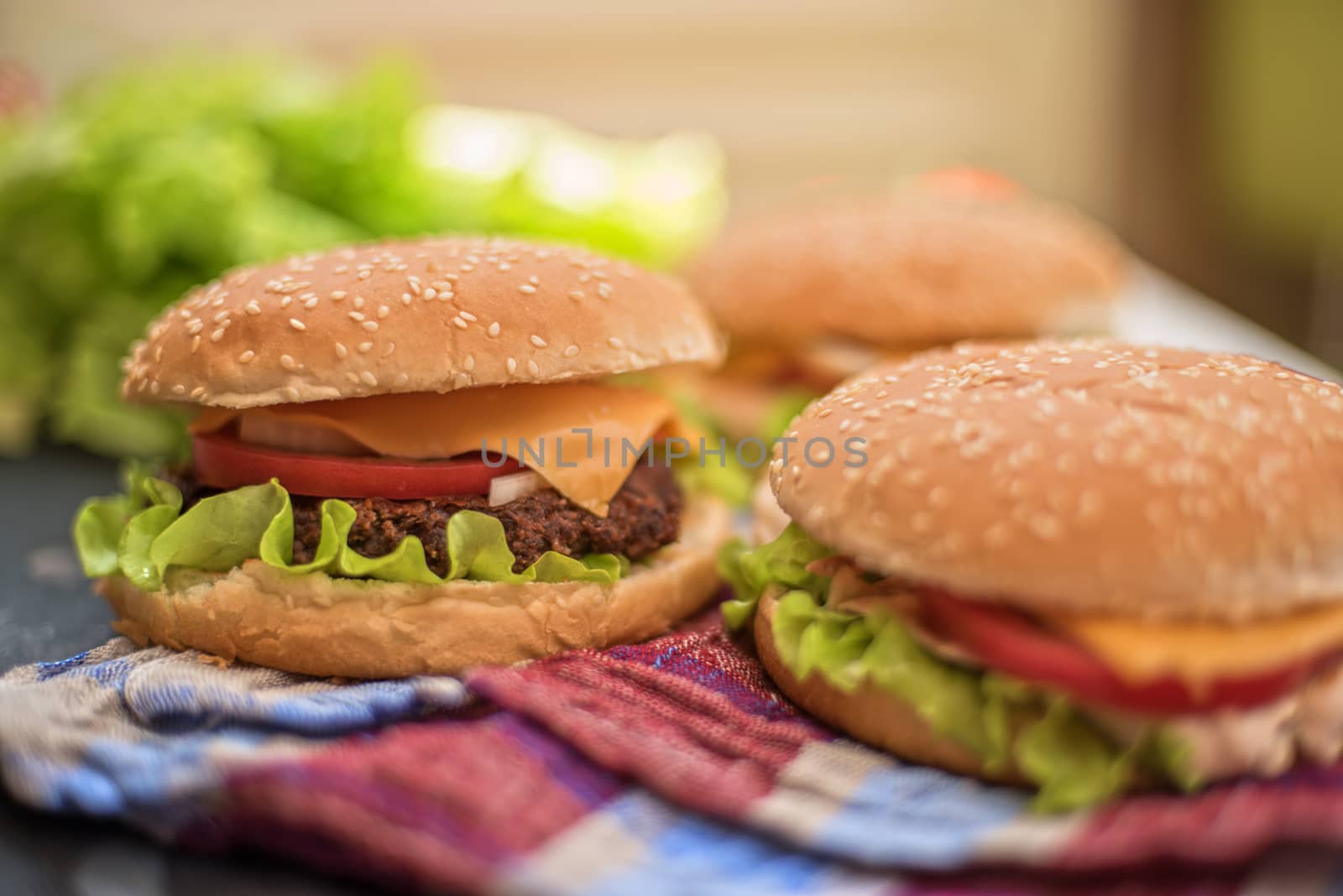 Closeup of home made burgers on wooden table
