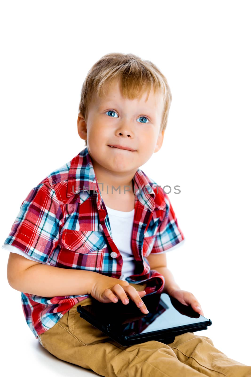 Little boy with a tablet computer on a white background