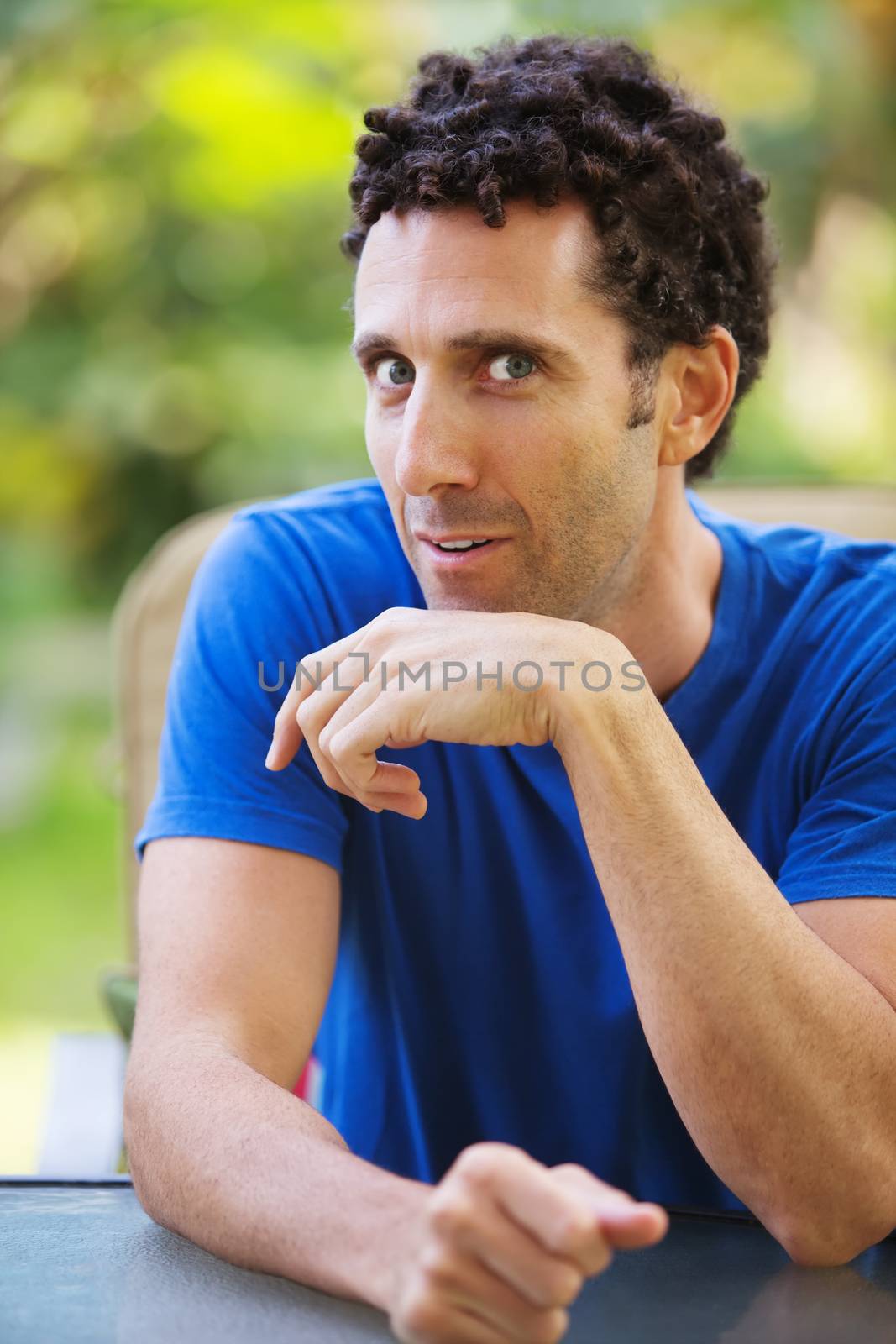 Eager single Caucasian man at table talking