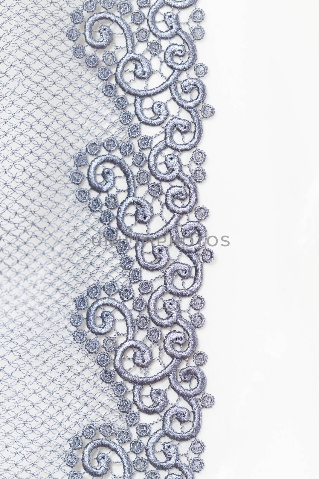 Decorative silver lace on insolated white background