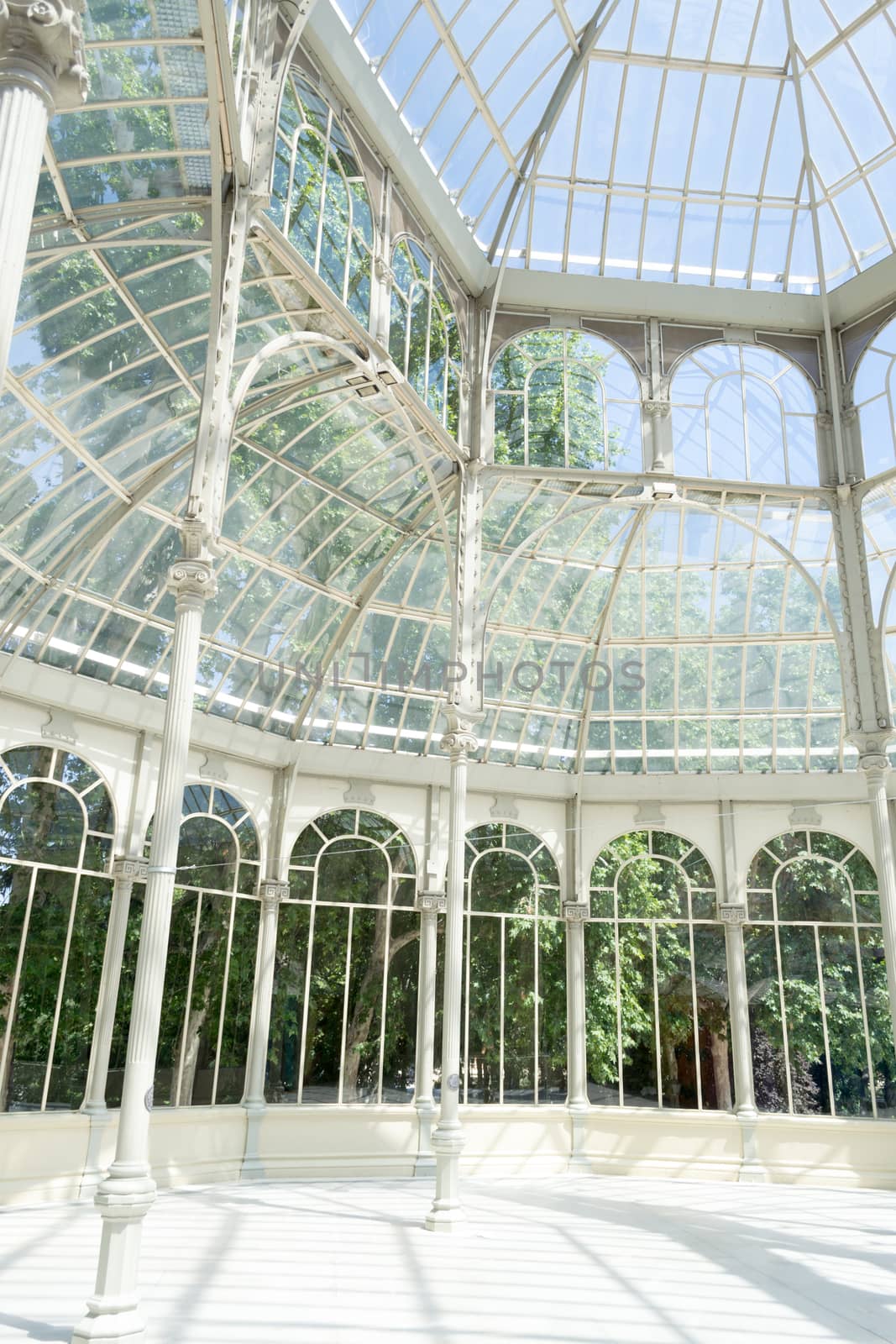 The Crystal Palace is located in the heart of the buen retiro park in Madrid in front of a lake