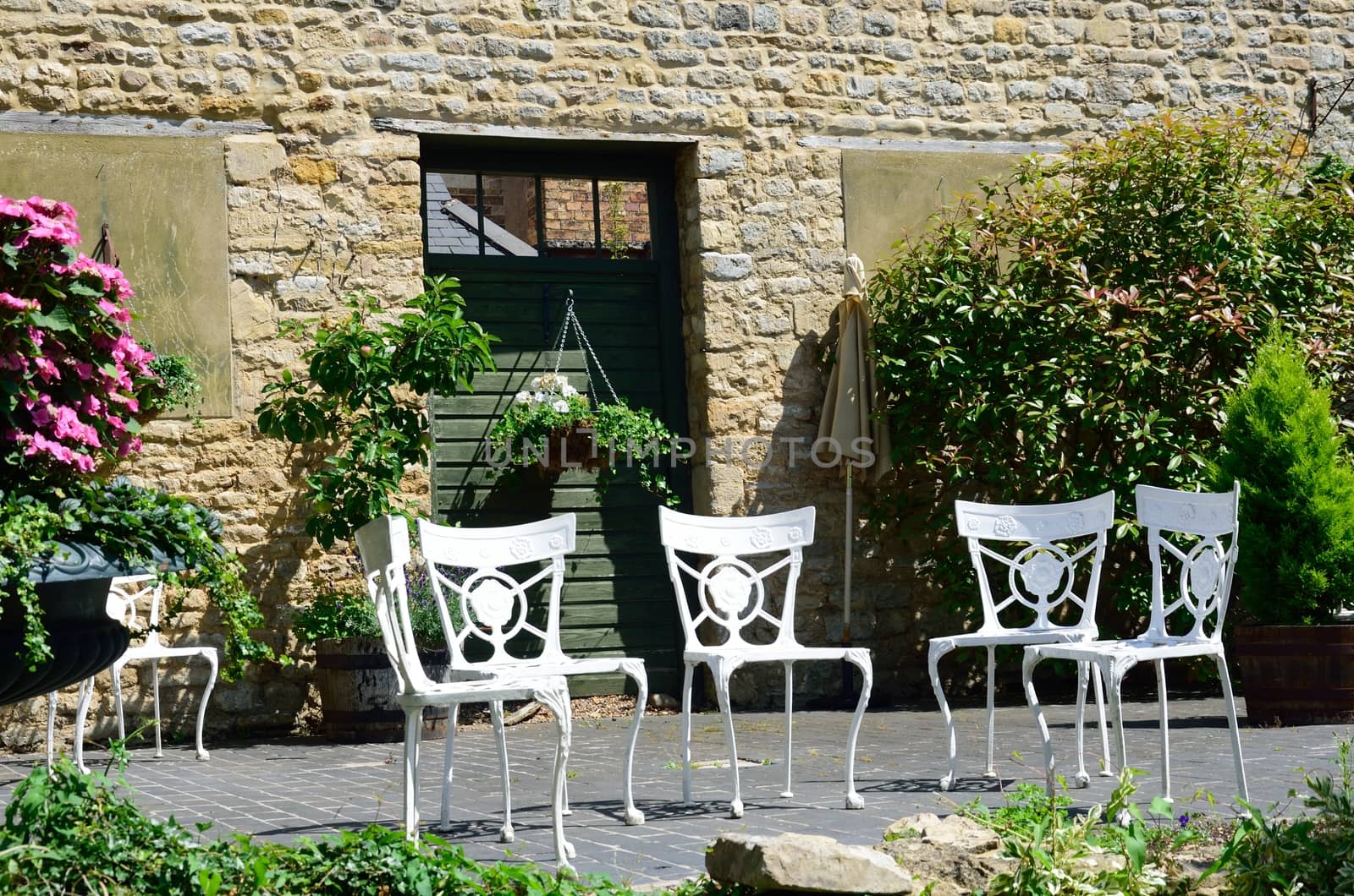 Four cast iron white garden chairs