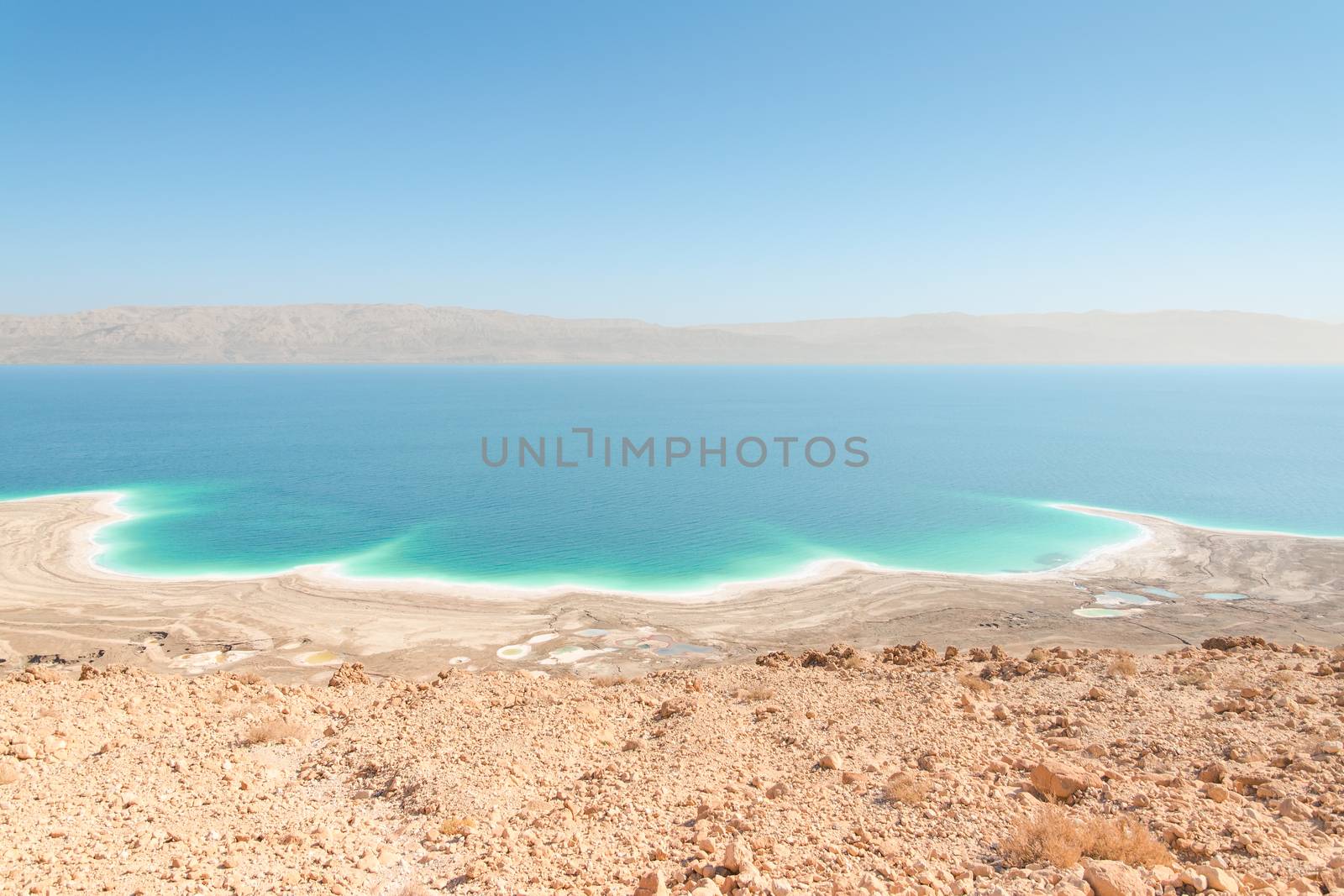 Exotic landscape Dead Sea shoreline aerial view with mountains r by servickuz