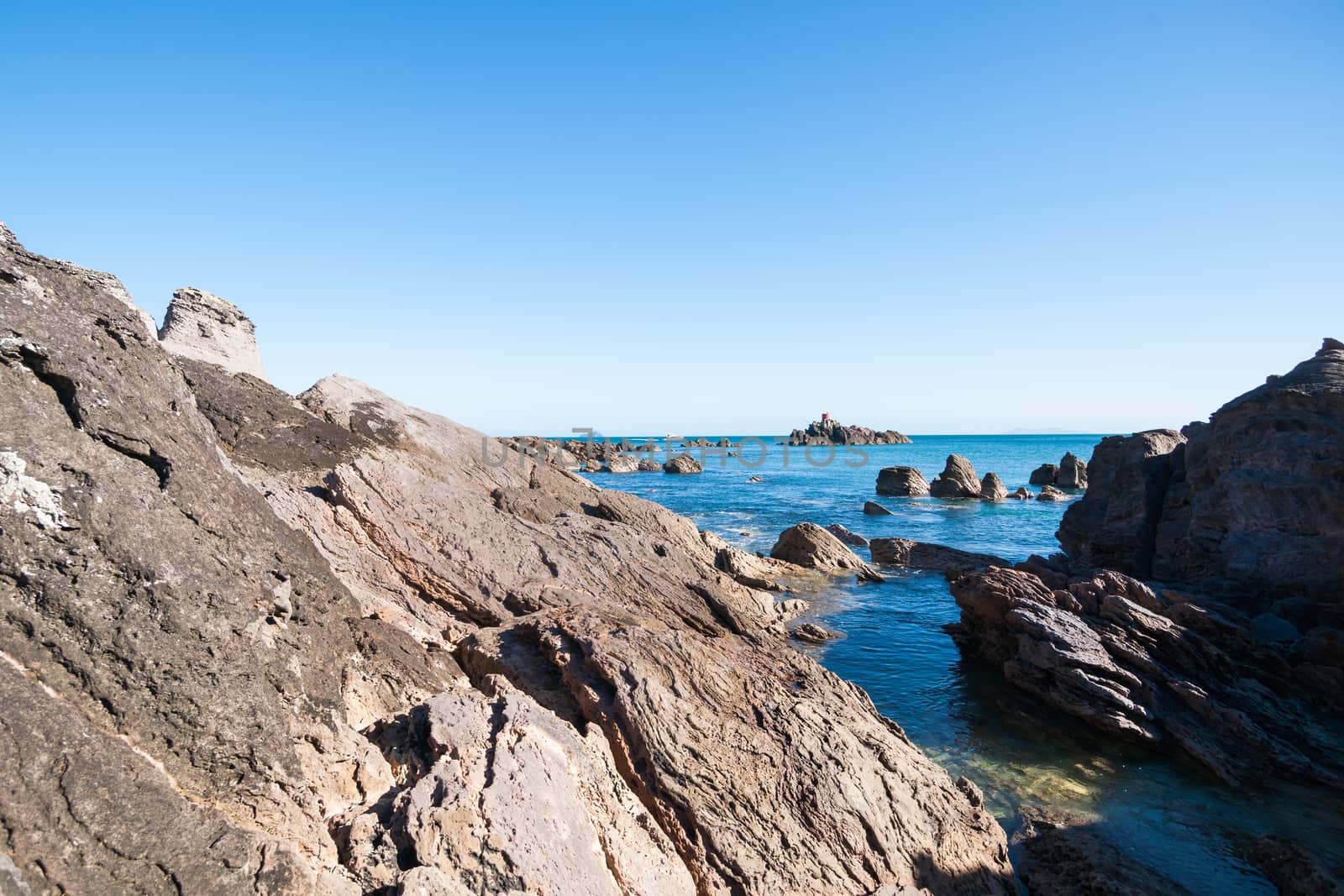 Mount Maunganui, rocky coastline at foot of mount  by brians101