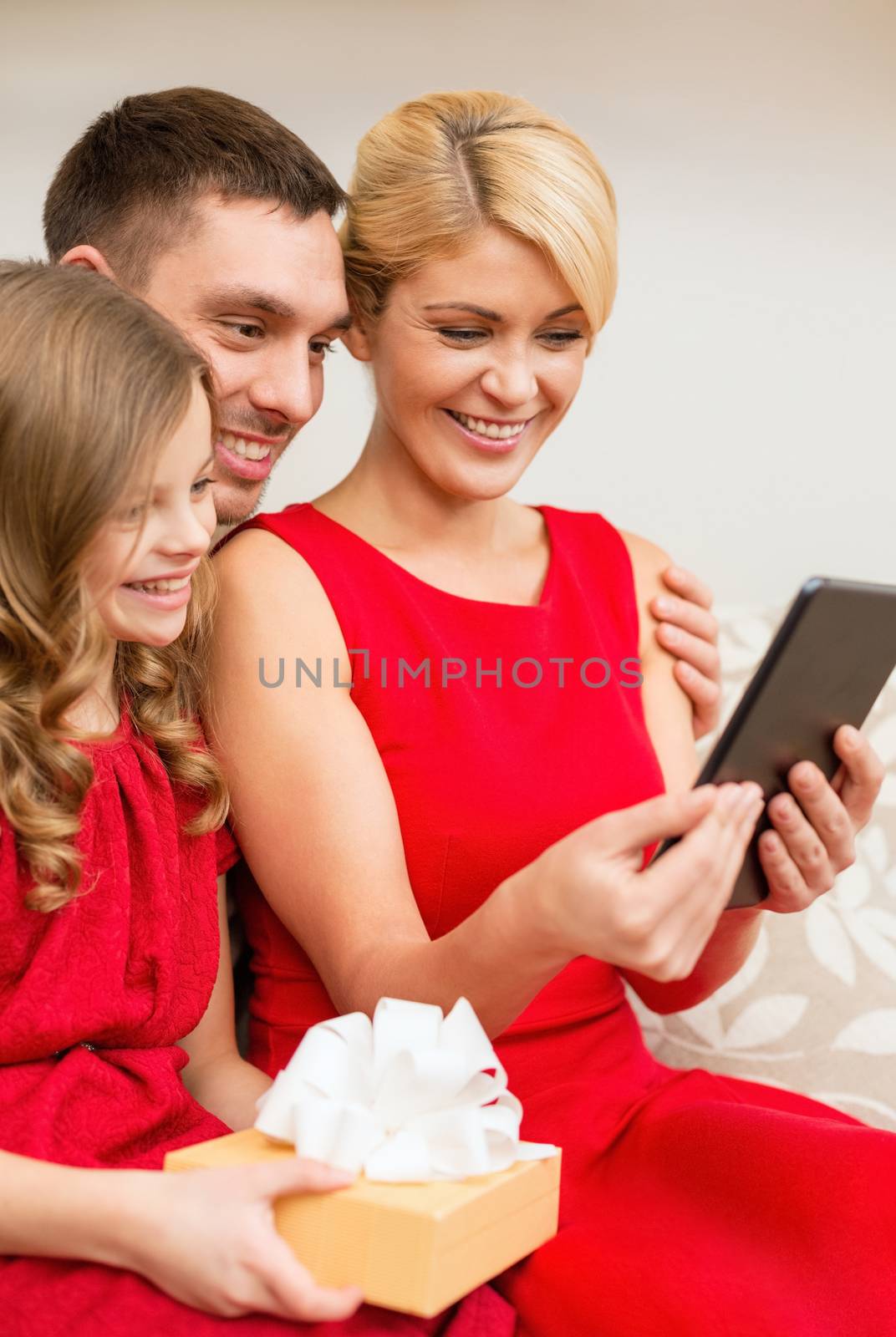 family, christmas, happiness, technology and people concept - smiling family with tablet pc