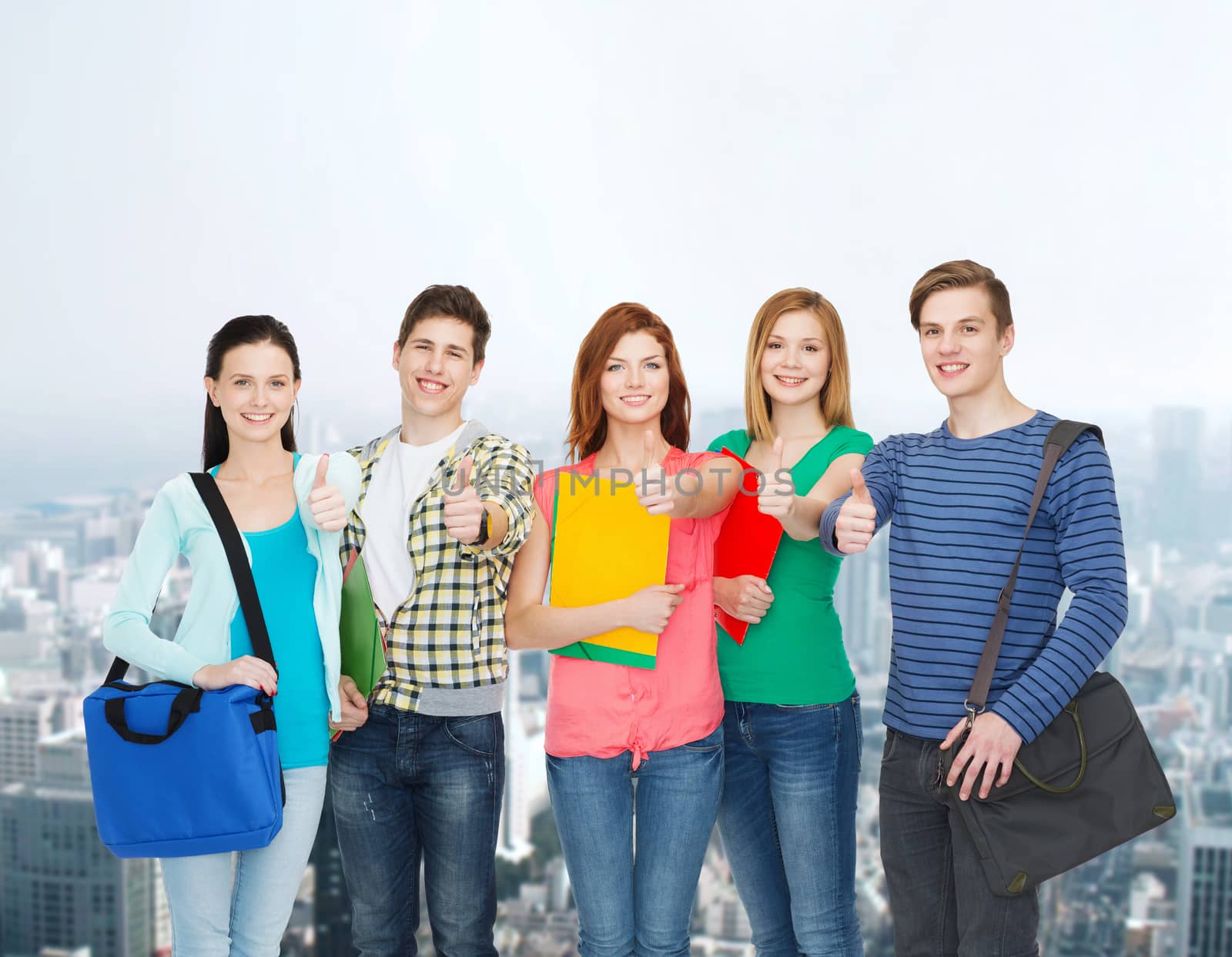 education and people concept - group of smiling students standing