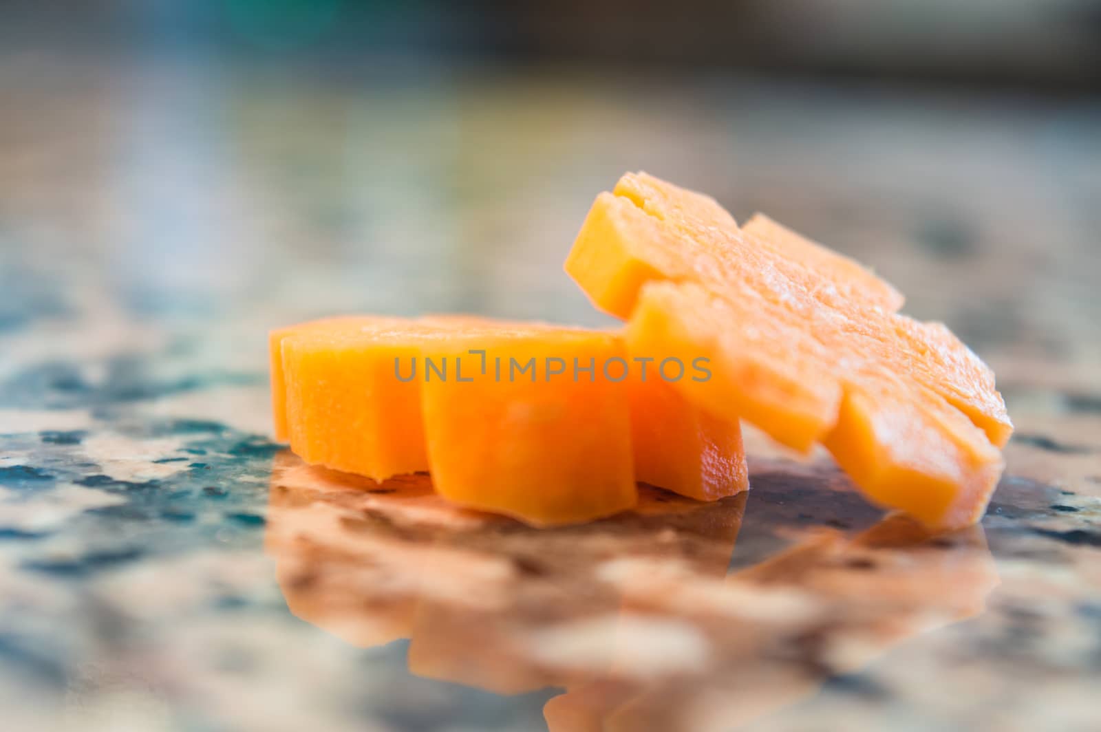 Carrot slices isolated on a granite