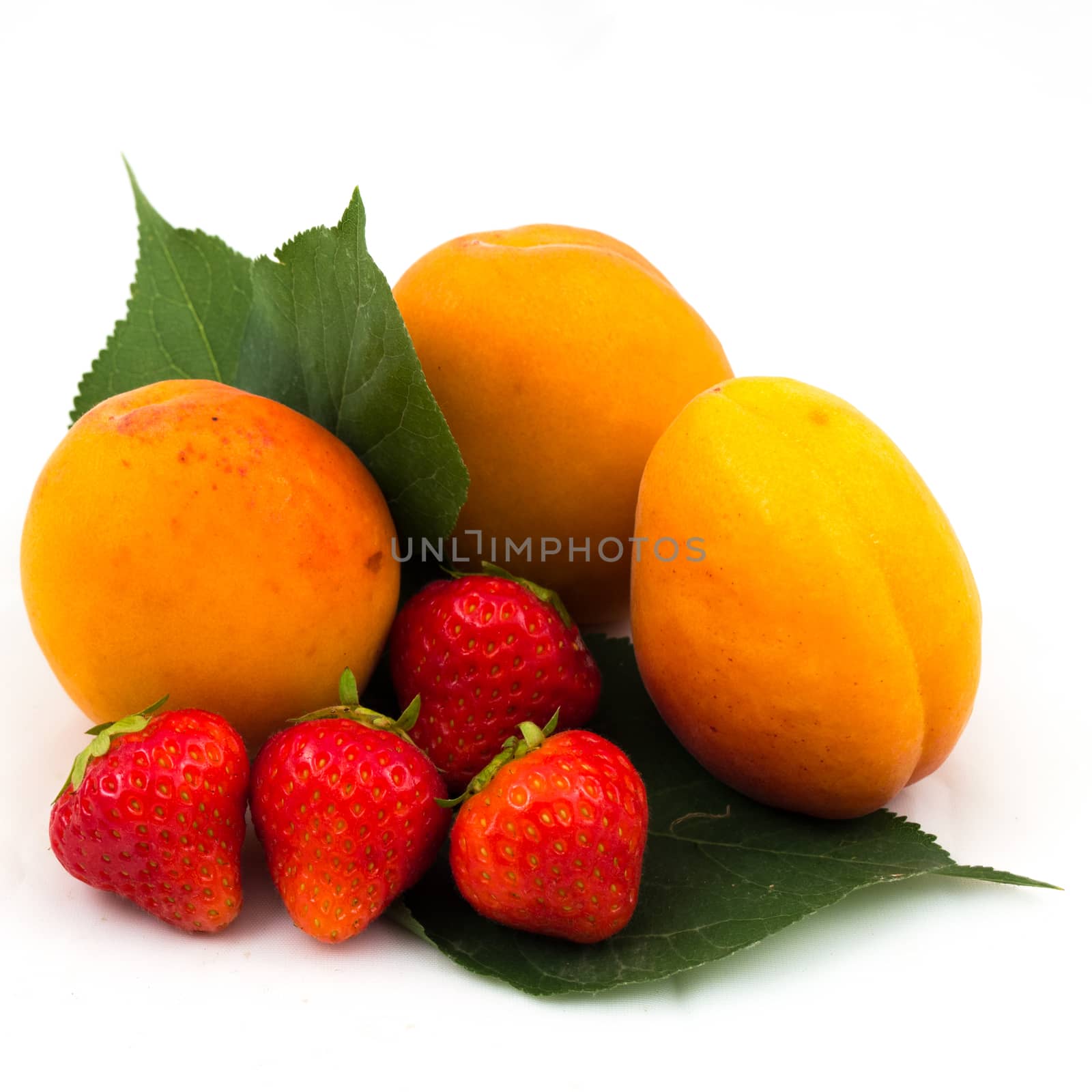 strawberries and apricots closeup