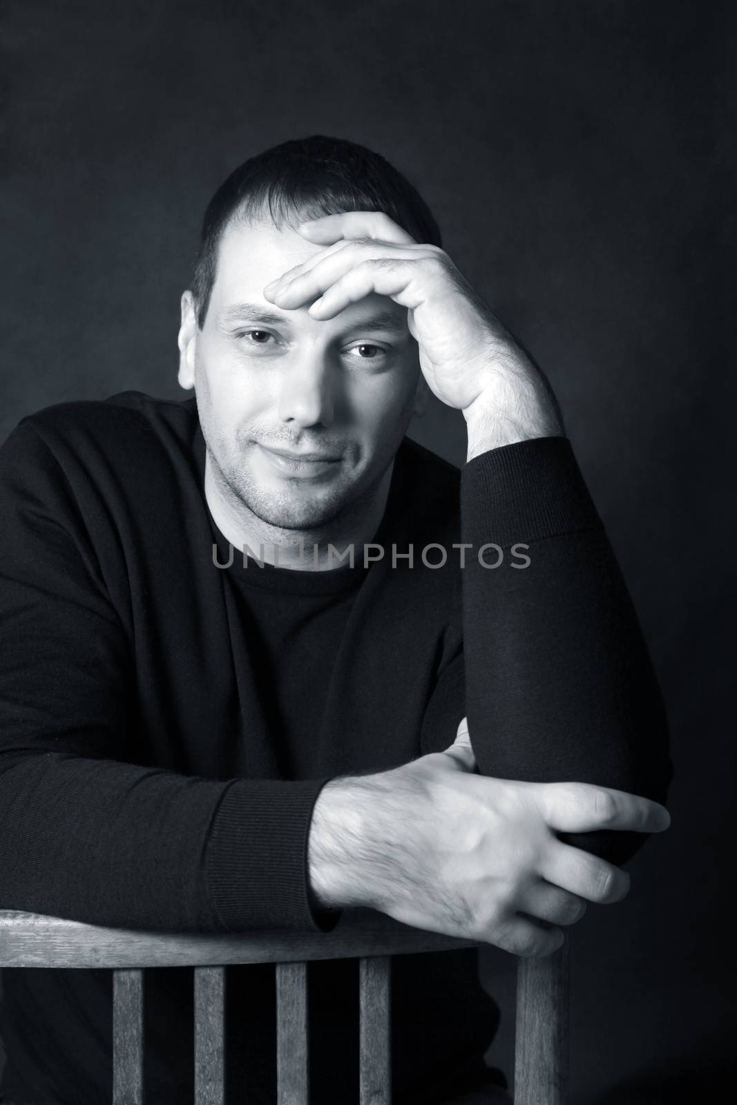 Studio portrait of man isolated on grey background