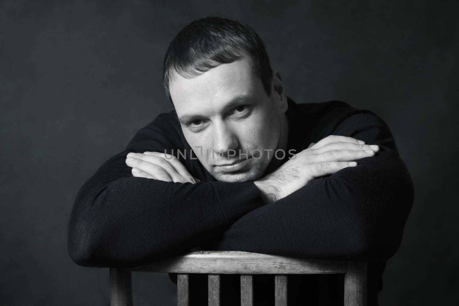 Studio portrait of man isolated on grey background