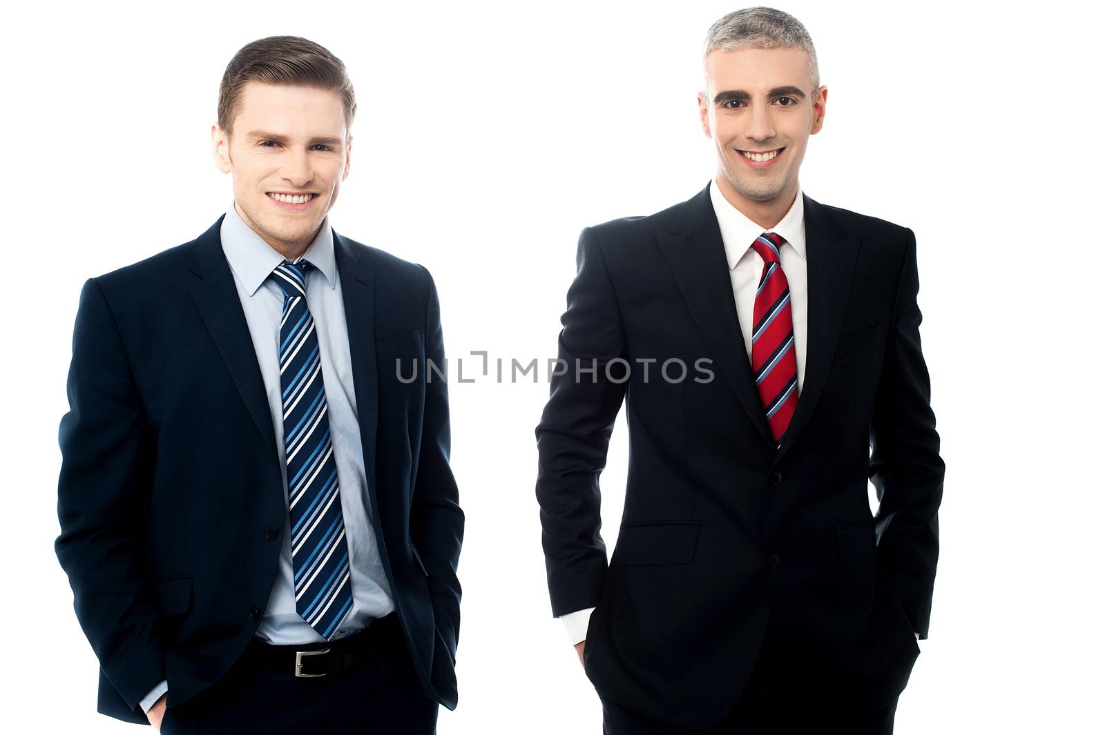 Business partners posing to camera after deal