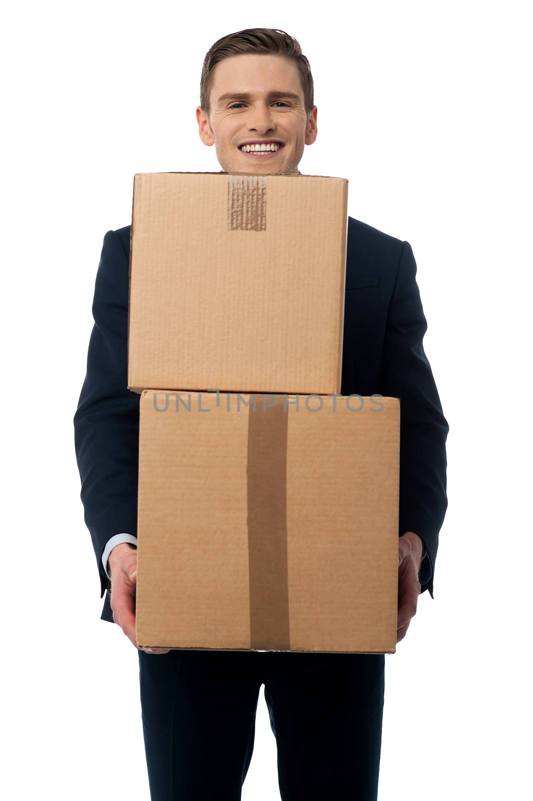 Happy businessman carrying cardboard boxes.