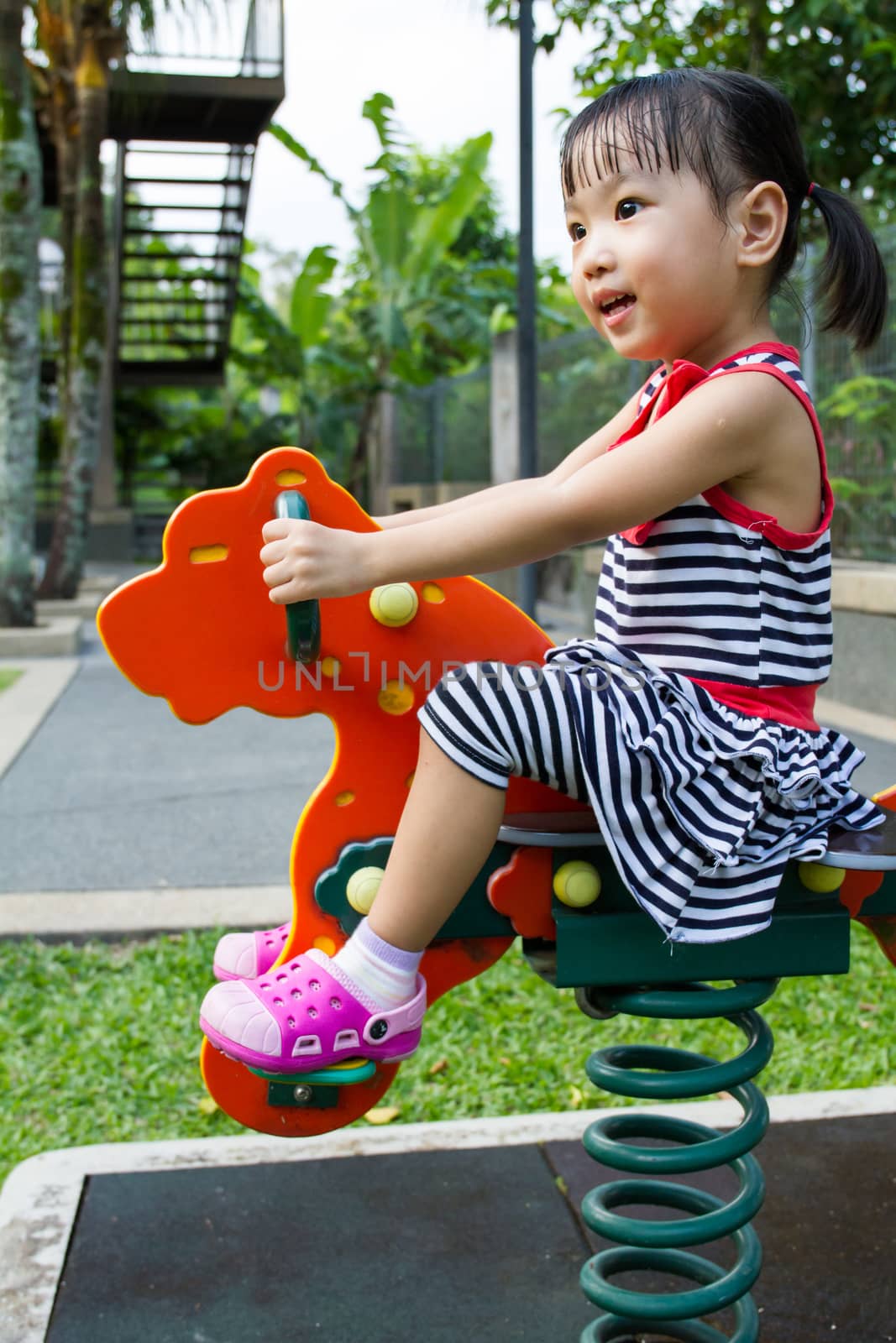 Asian Kid Riding at Park by kiankhoon