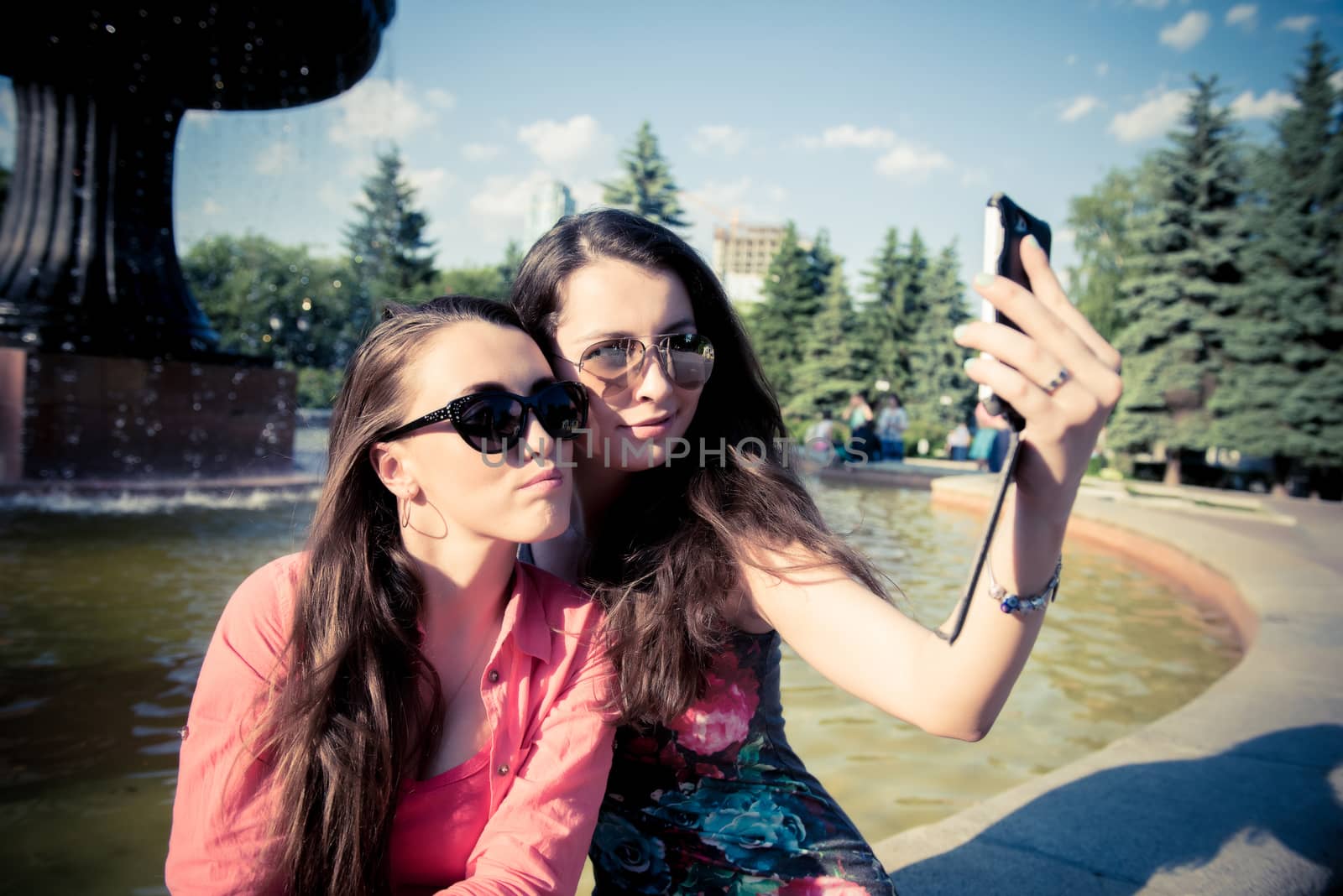Two young women taking a selfie outdoors by shesaysboo