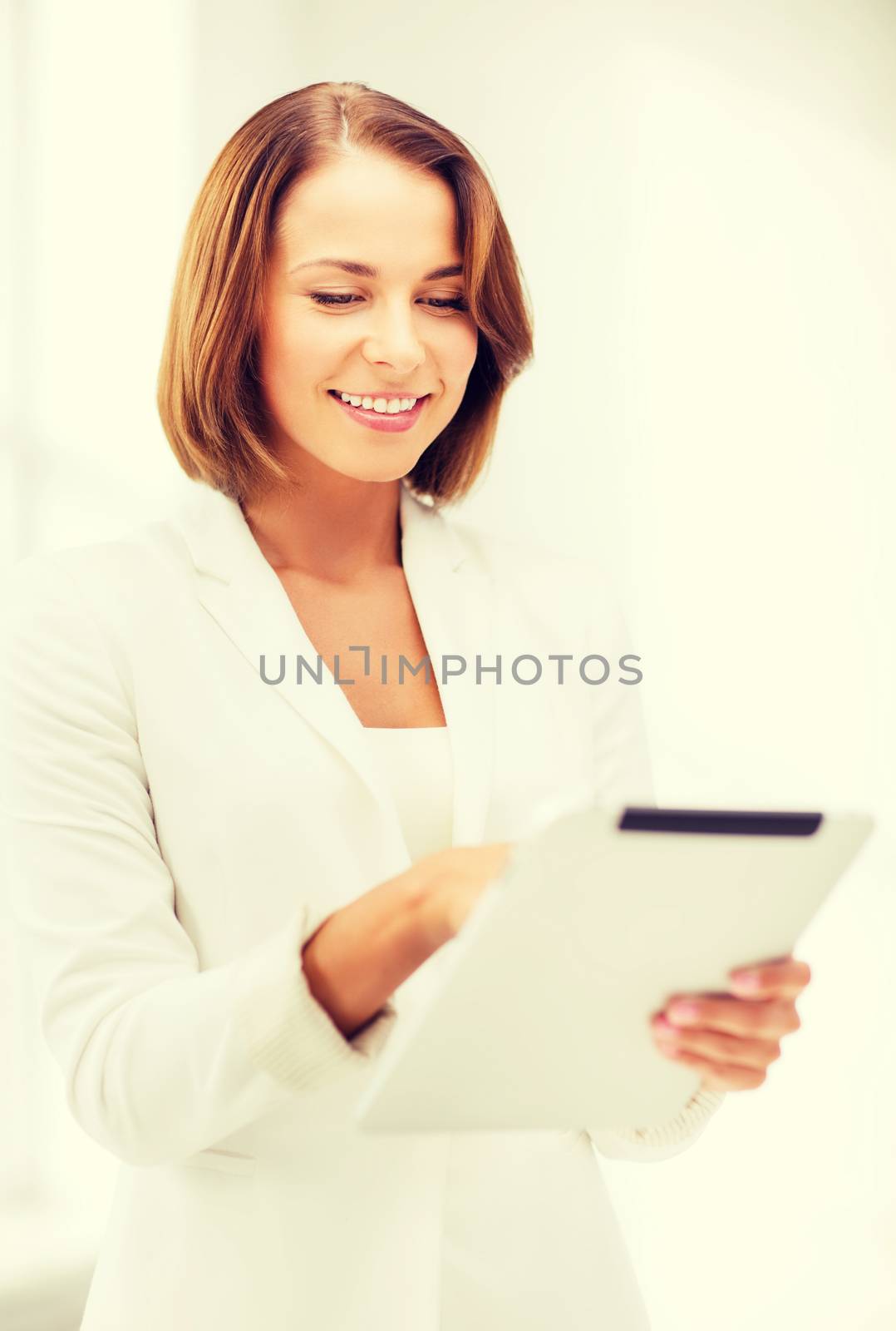 office, business, technology and internet concept - businesswoman with tablet pc in office