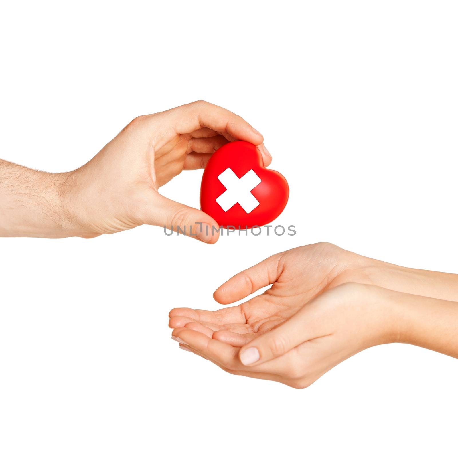 hand giving heart with red cross symbol by dolgachov