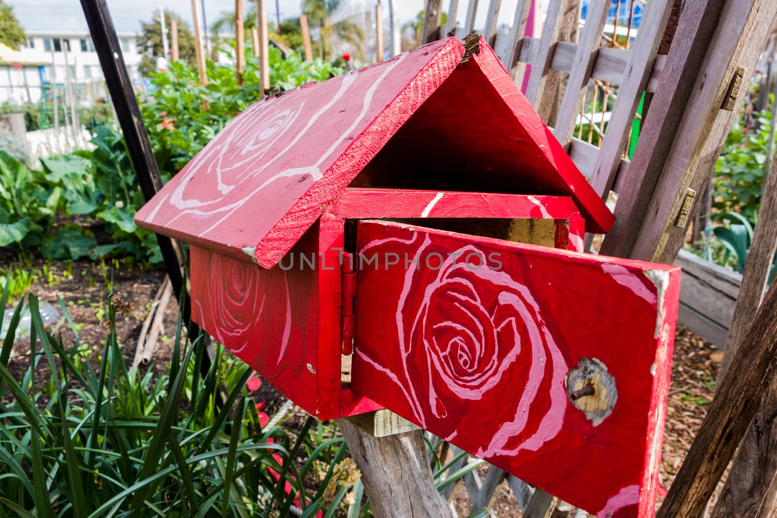 Red Wooden Letterbox with a Floral  Pattern by davidhewison