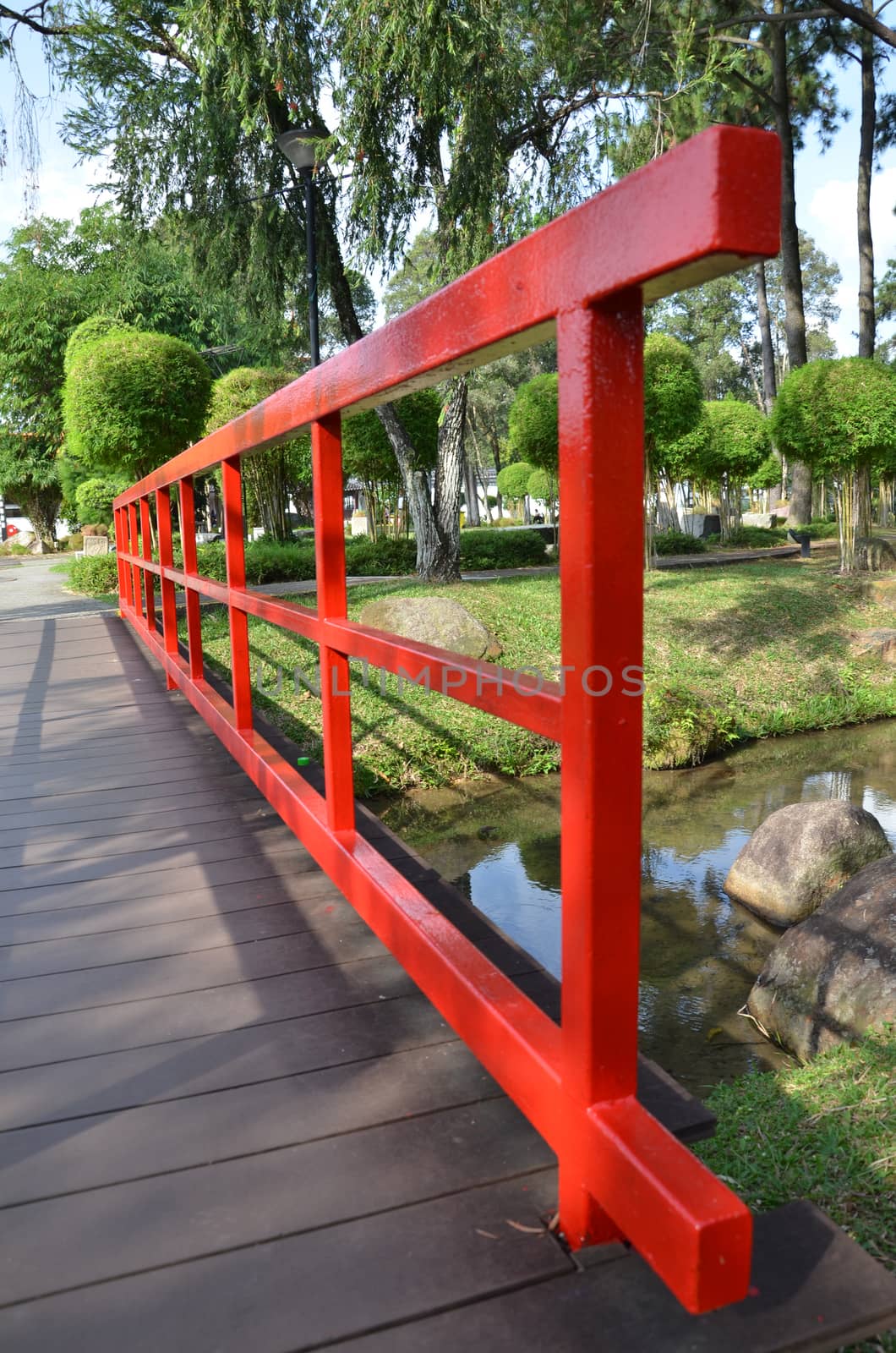 Red bridge in Chinese Garden by tang90246