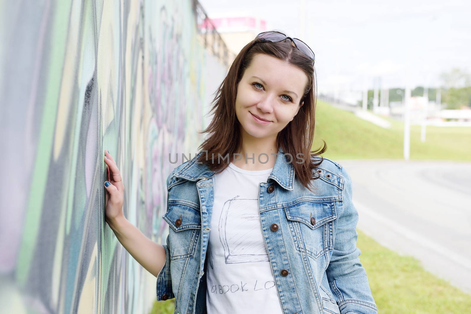 girl in sunglasses near graffiti wall by shesaysboo