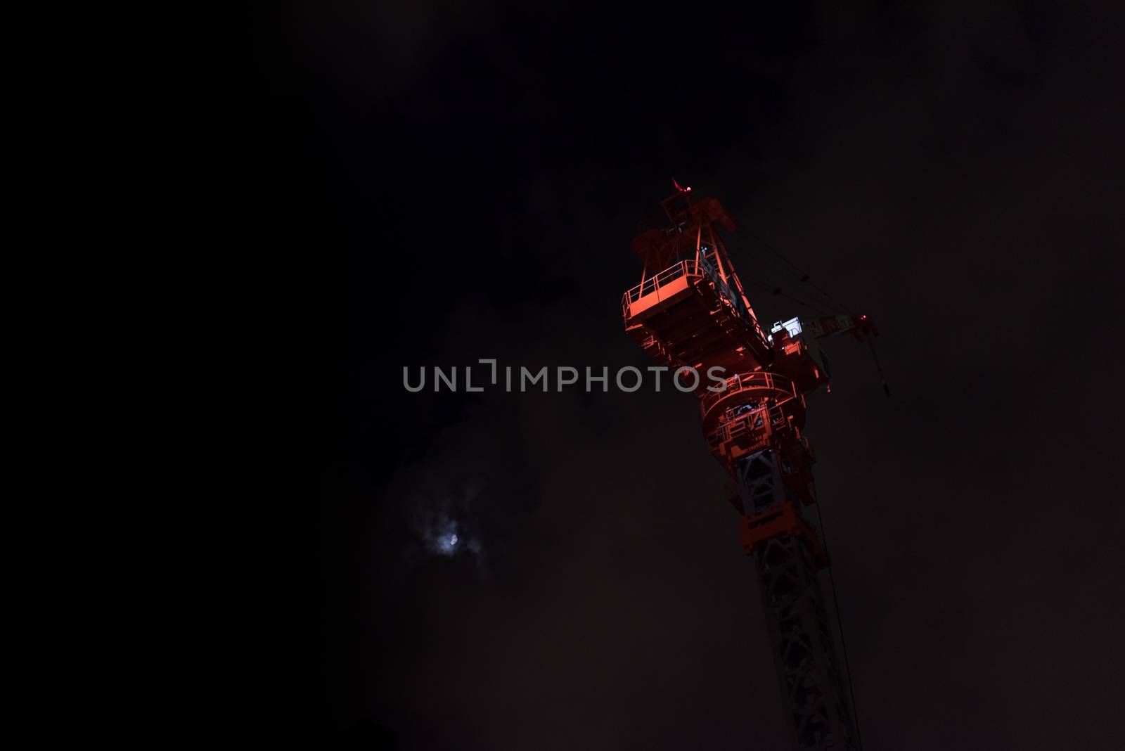 Lit Crane on a Dark Sky Background by justtscott