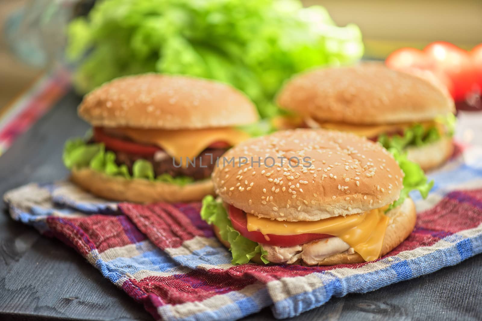 Closeup of home made burgers on wooden table