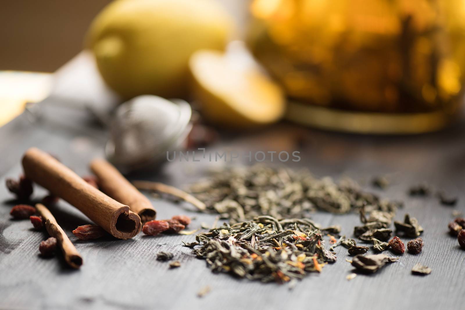 tea composition with cinnamon sticks, lemons