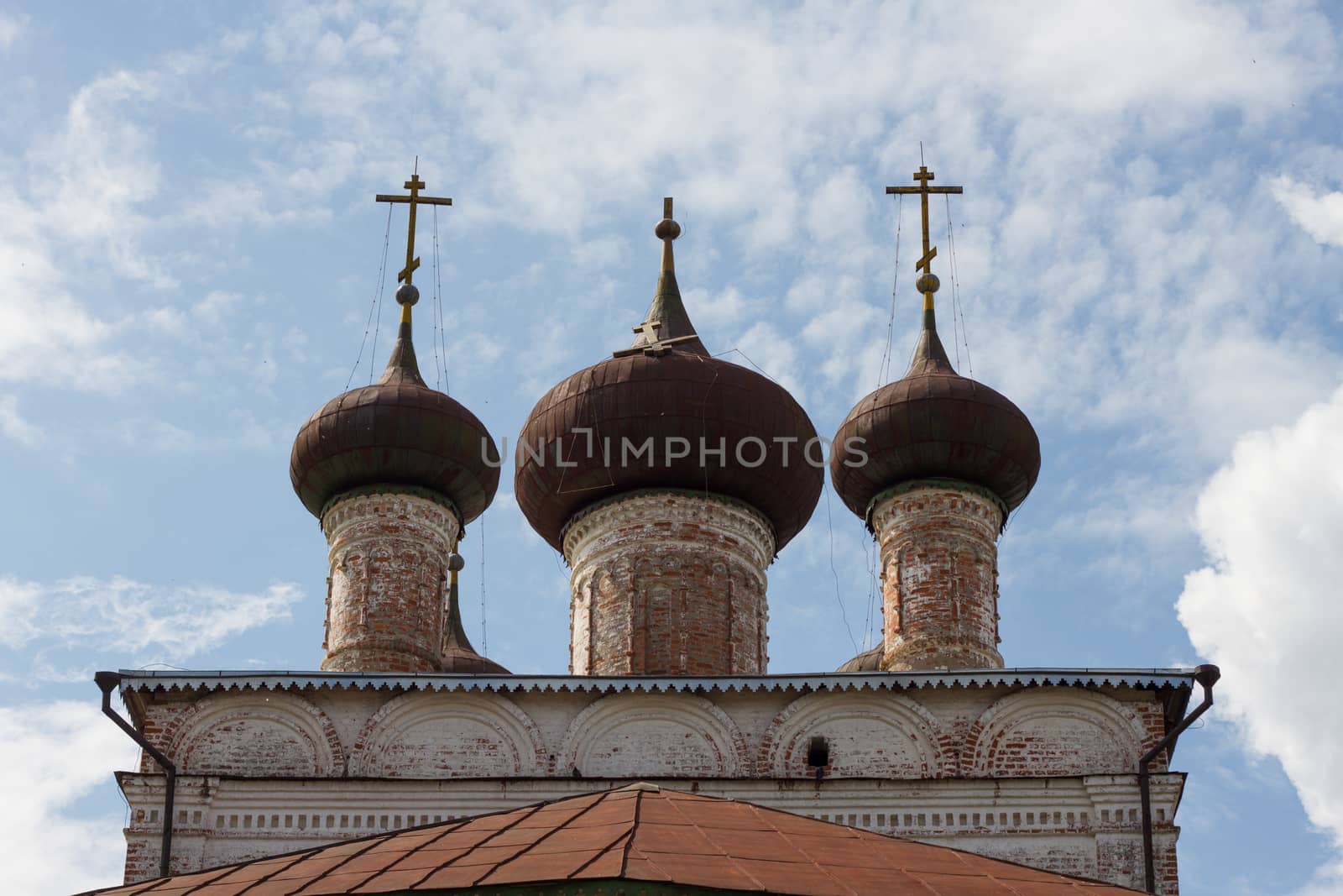 Three crosses, one in the center fell old building of the Orthodox Church religion Christianity background