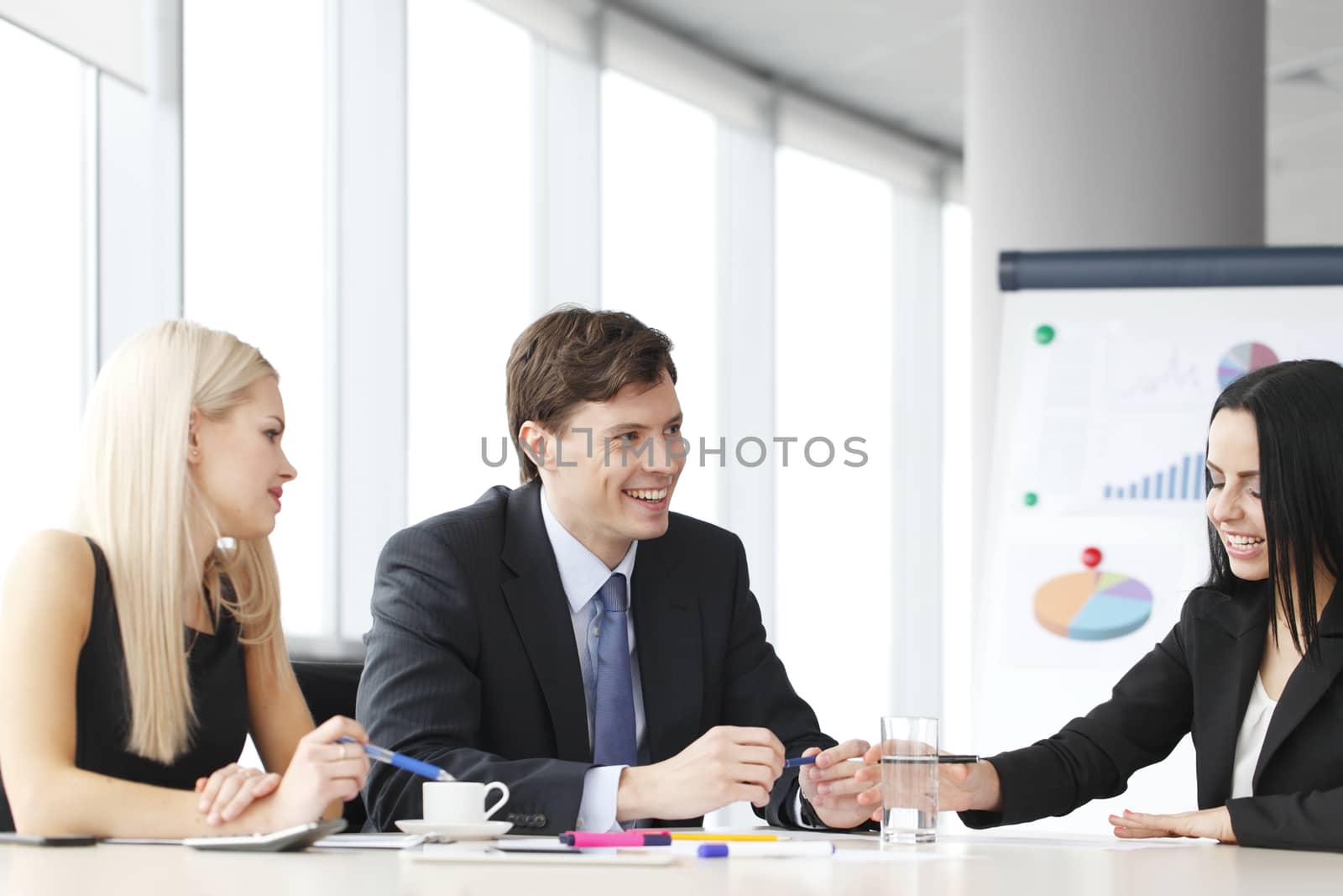 Teamwork of business people discussing reports in office