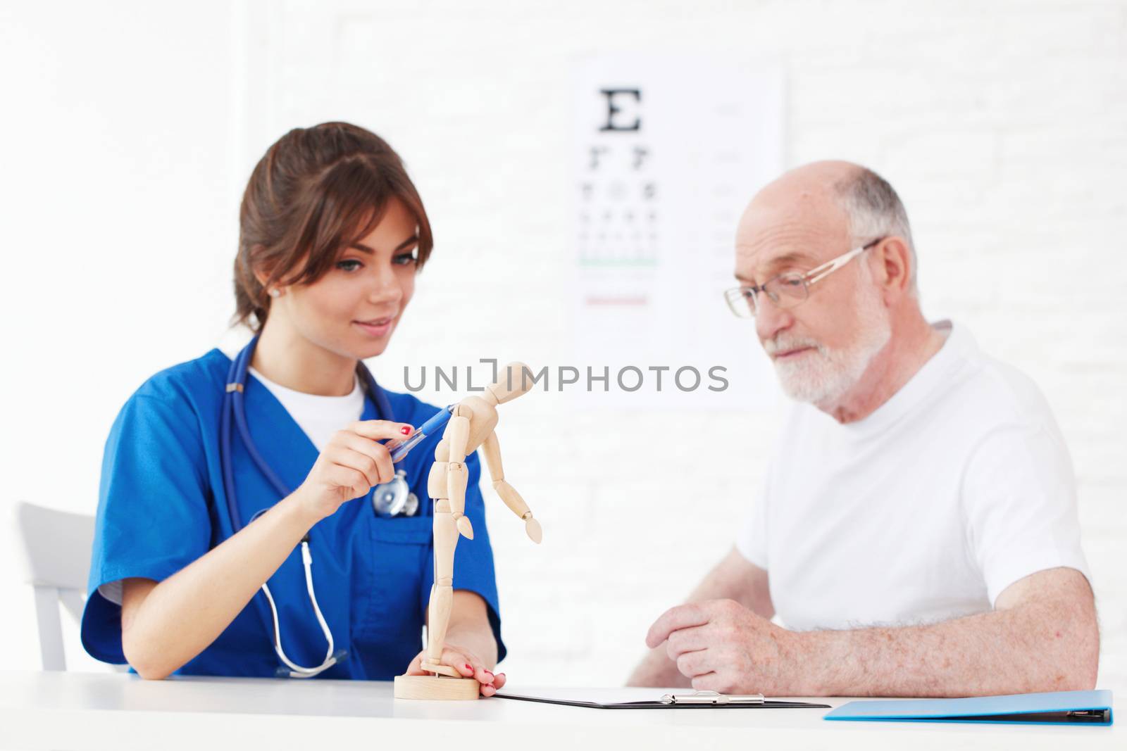 nurse and doctor looking at human figure