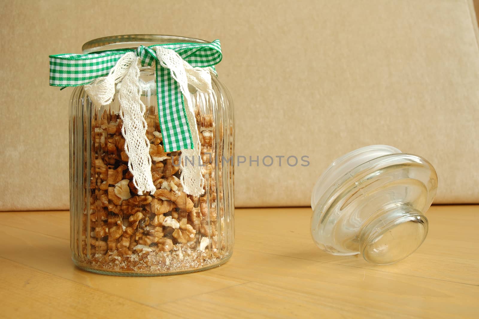 Glass jar with band full of cracked walnuts