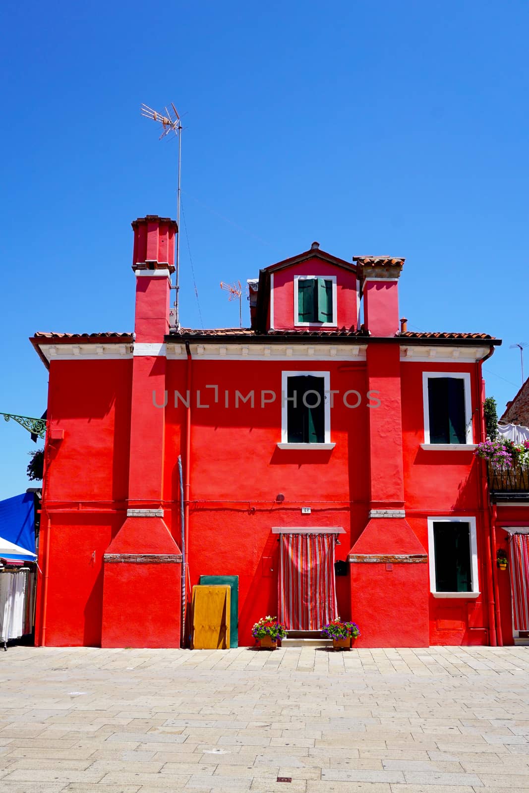 Burano red color building architecture, Venice, Italy