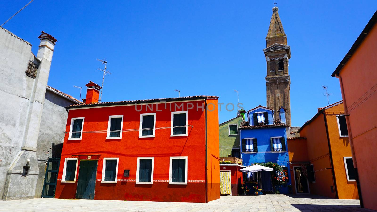 Burano colorful building architecture with church background, Venice, Italy