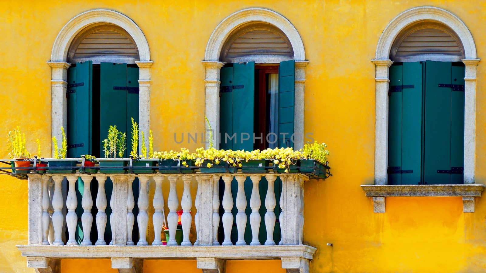 two Doors and terrace in Burano on yellow color wall building architecture,Venice, Italy