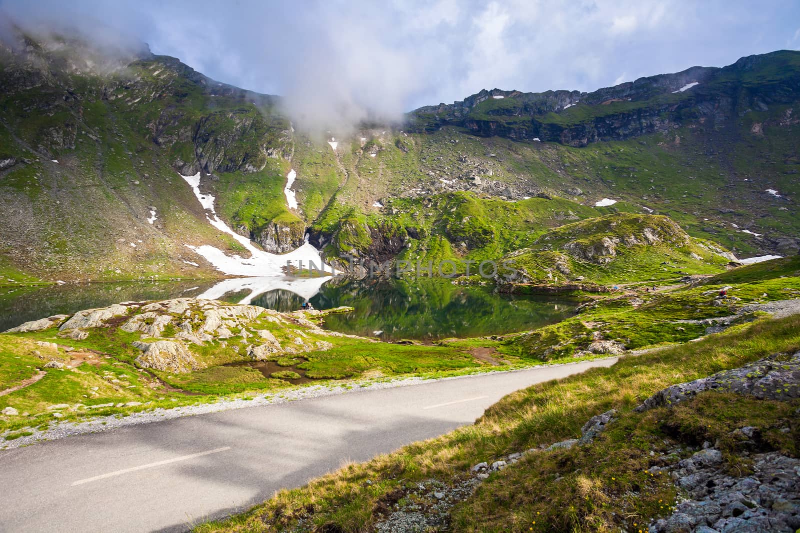 Idyllic view with on Balea Lake shore seen from Transfagarasan road in Fagaras Mountains, Romania.